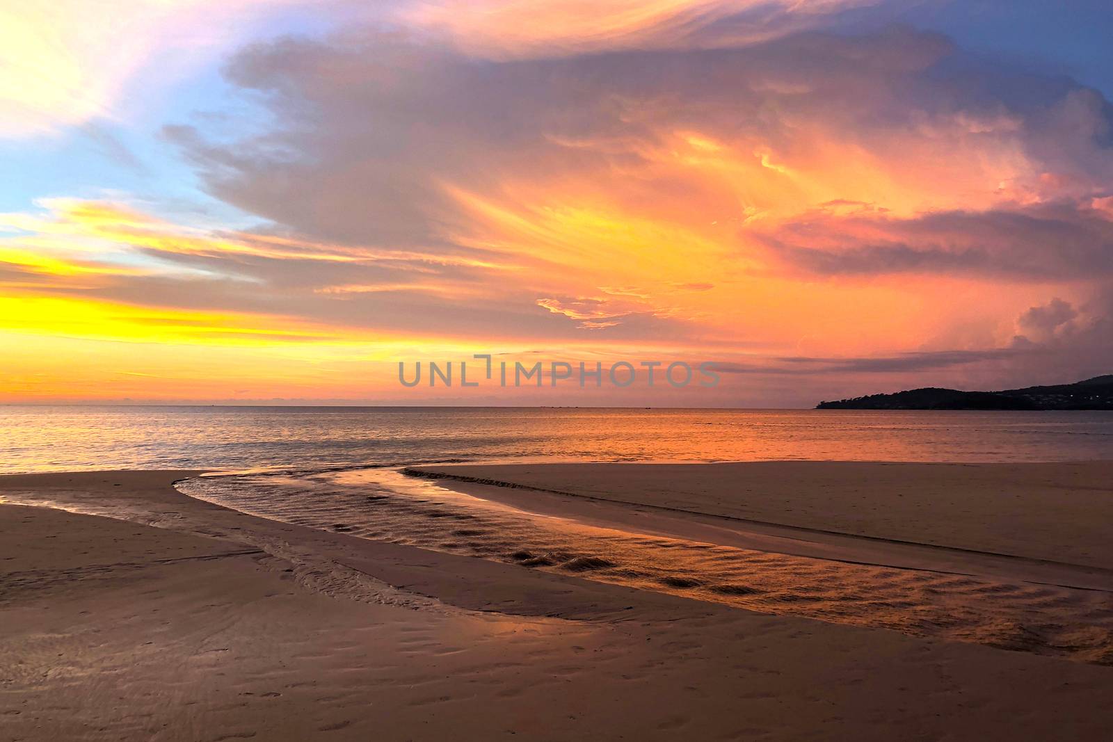 View of sunset at Karon beach in Phuket, Thailand by Surasak