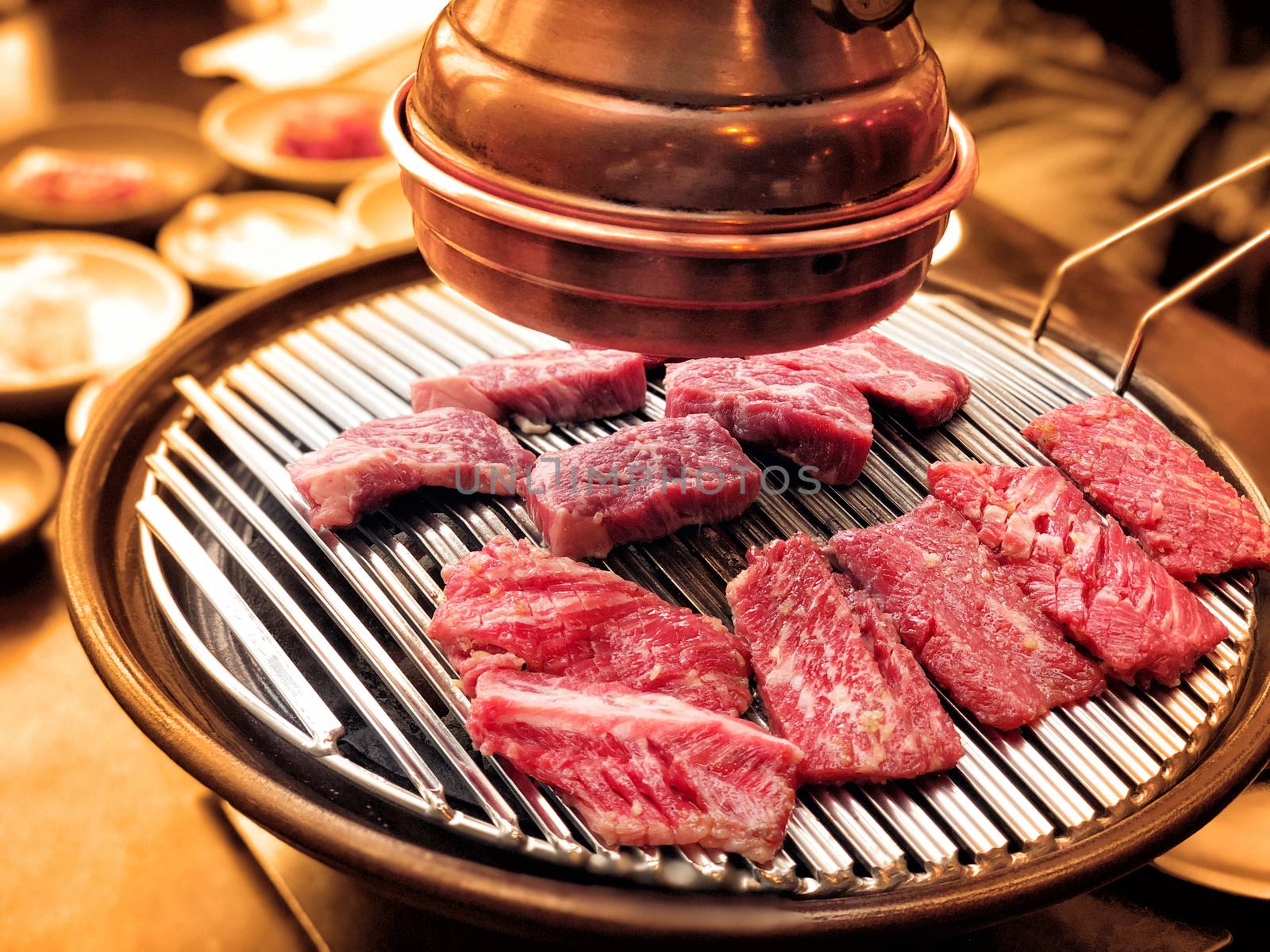 Korean beef barbecue, a popular korean cuisine of grilling meat by Surasak