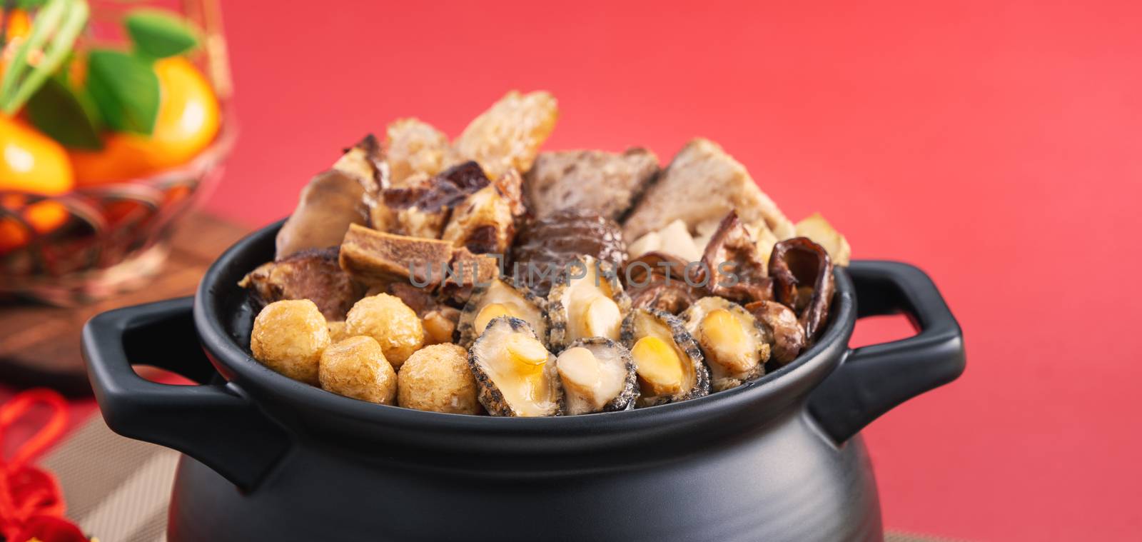 Traditional food of Chinese lunar new year, Buddha jumps over the wall, Chinese Soup Casserole dish, Buddha's Temptation, named Fo Tiao Qiang, close up.
