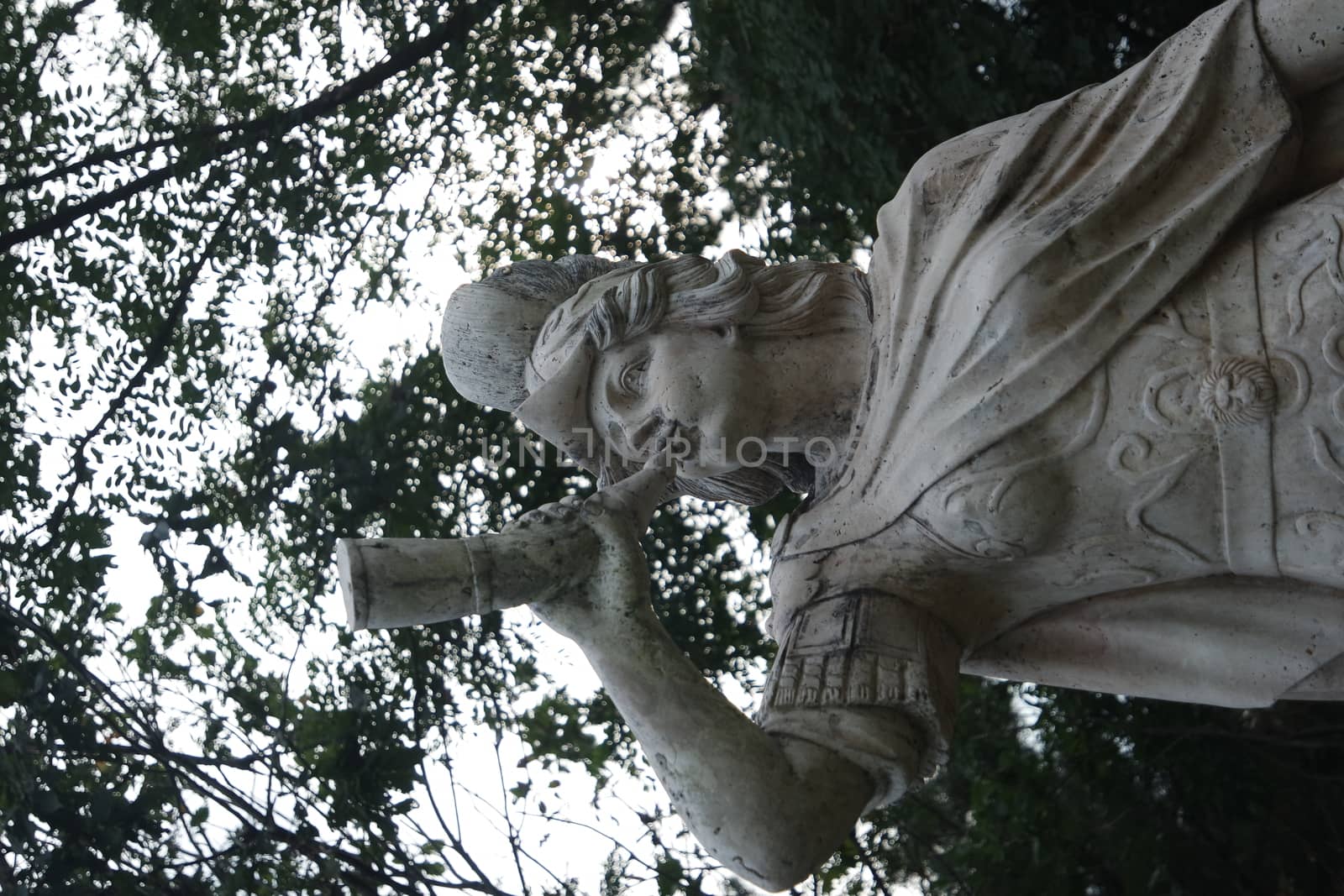 CHUNCHEON, SOUTH KOREA- October-03, 2020: sculpture of classical water god blowing conch shell - ancient natural trumpet. Stone sculpture of a Triton, blowing on his conch shell trumpet.