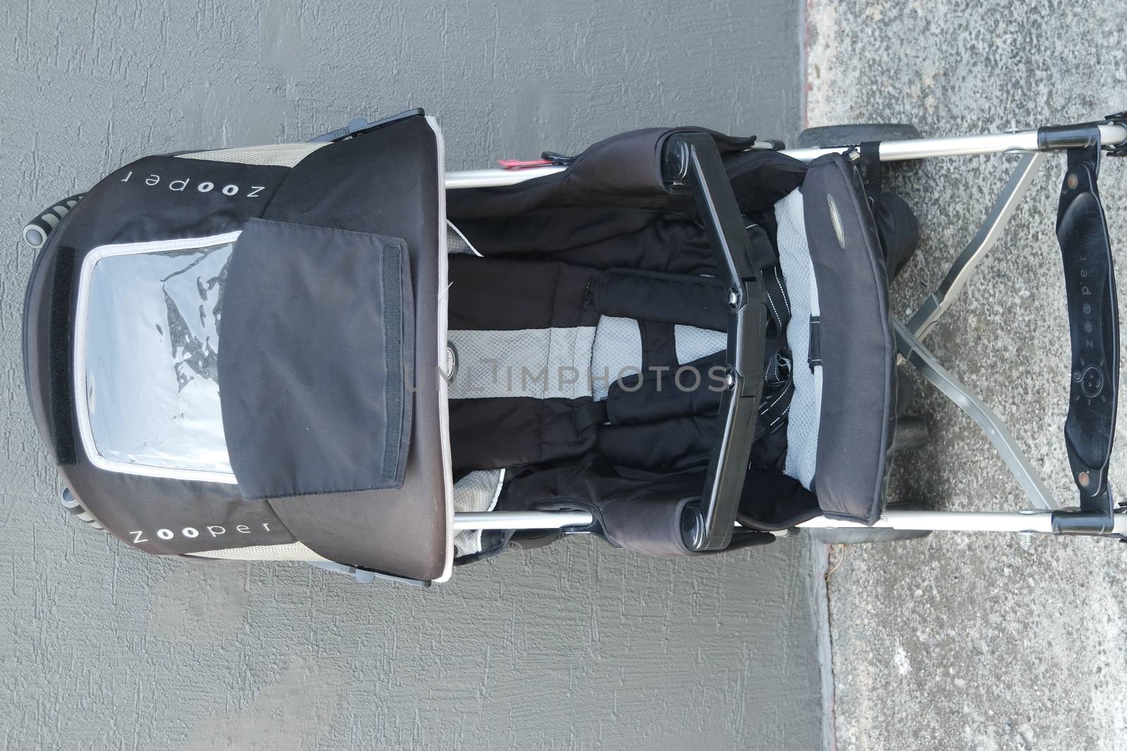 Black color baby stroller with head covering by Photochowk