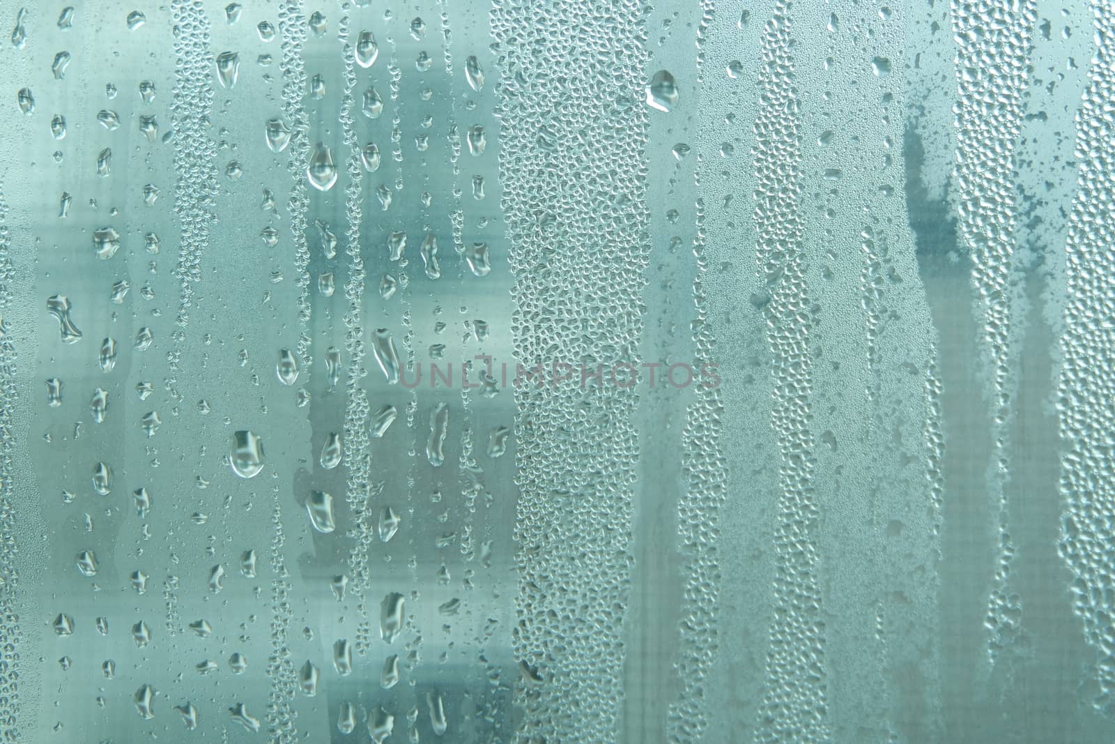 Bright grey color glassy texture, with water drops on it. Water drop glassy background