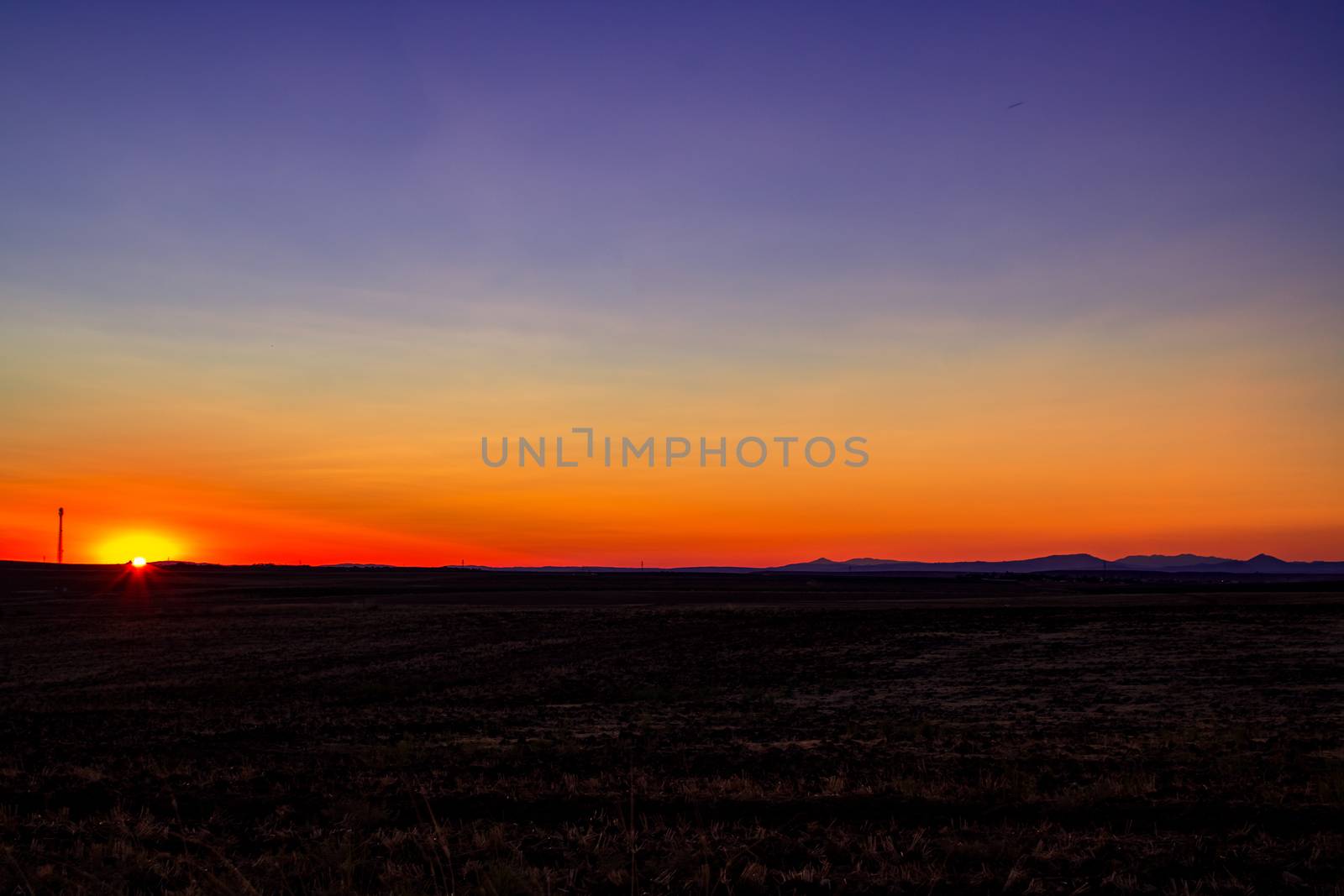 Sunset empty field and mountains by yenitasarimss