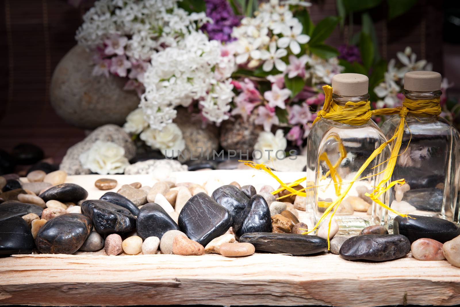 Aromatherapy, spa, beauty treatment and wellness background with massage stone, flowers, flacon.. spa concept
