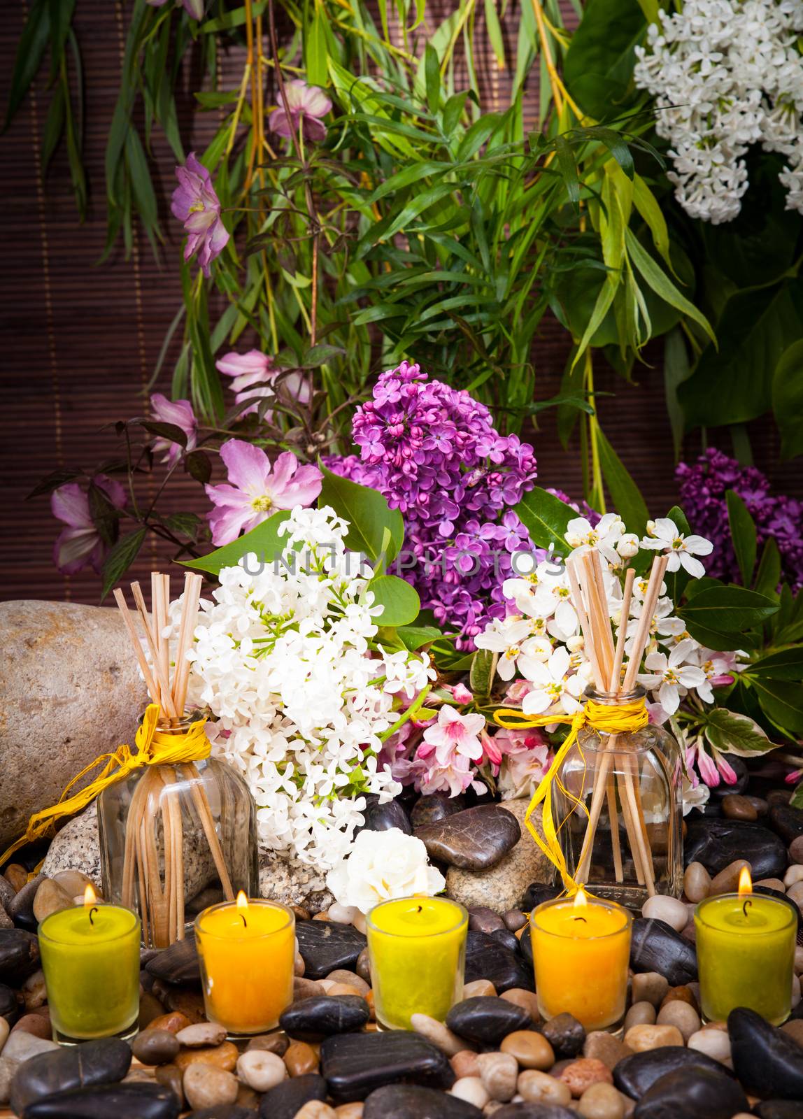 Aromatherapy, spa, beauty treatment and wellness background with massage stone, flowers, burning candles... spa concept