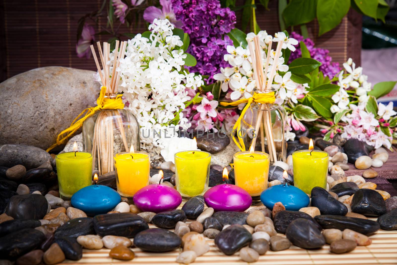 Aromatherapy, spa, beauty treatment and wellness background with massage stone, flowers, burning candles... spa concept