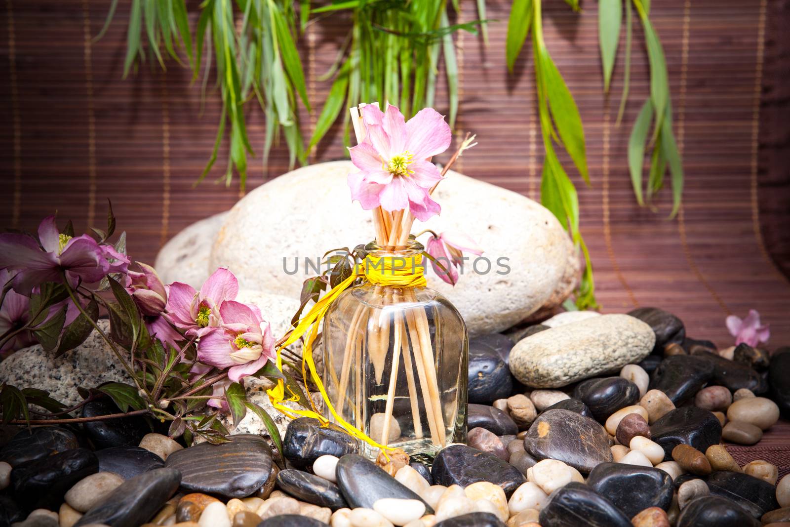 Aromatherapy, spa, beauty treatment and wellness background with massage stone, flowers, flacon.. spa concept