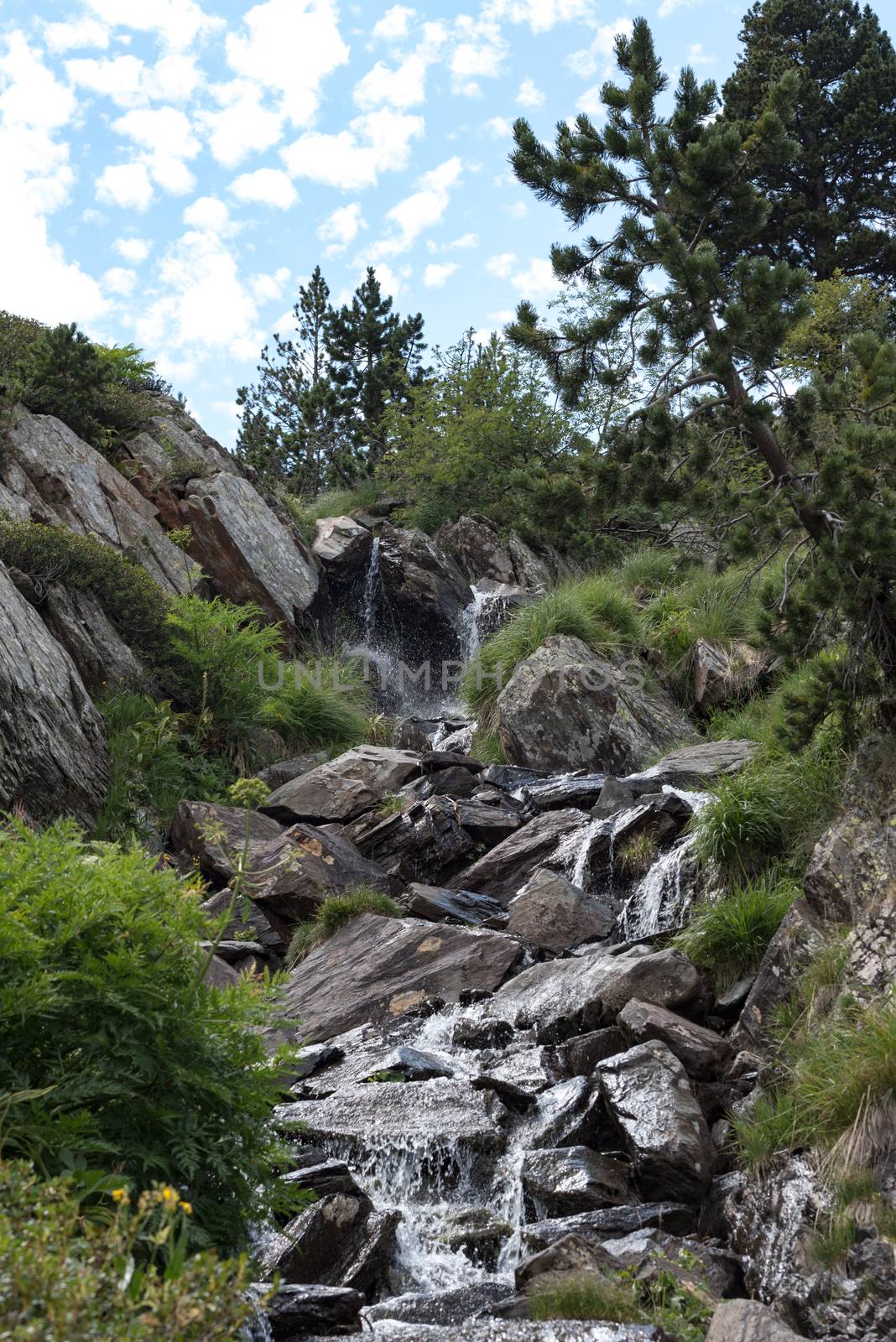 Mountain lake Estany de les Truites in Andorra Pyrenees, La Massana, Refugi de Coma Pedrosa