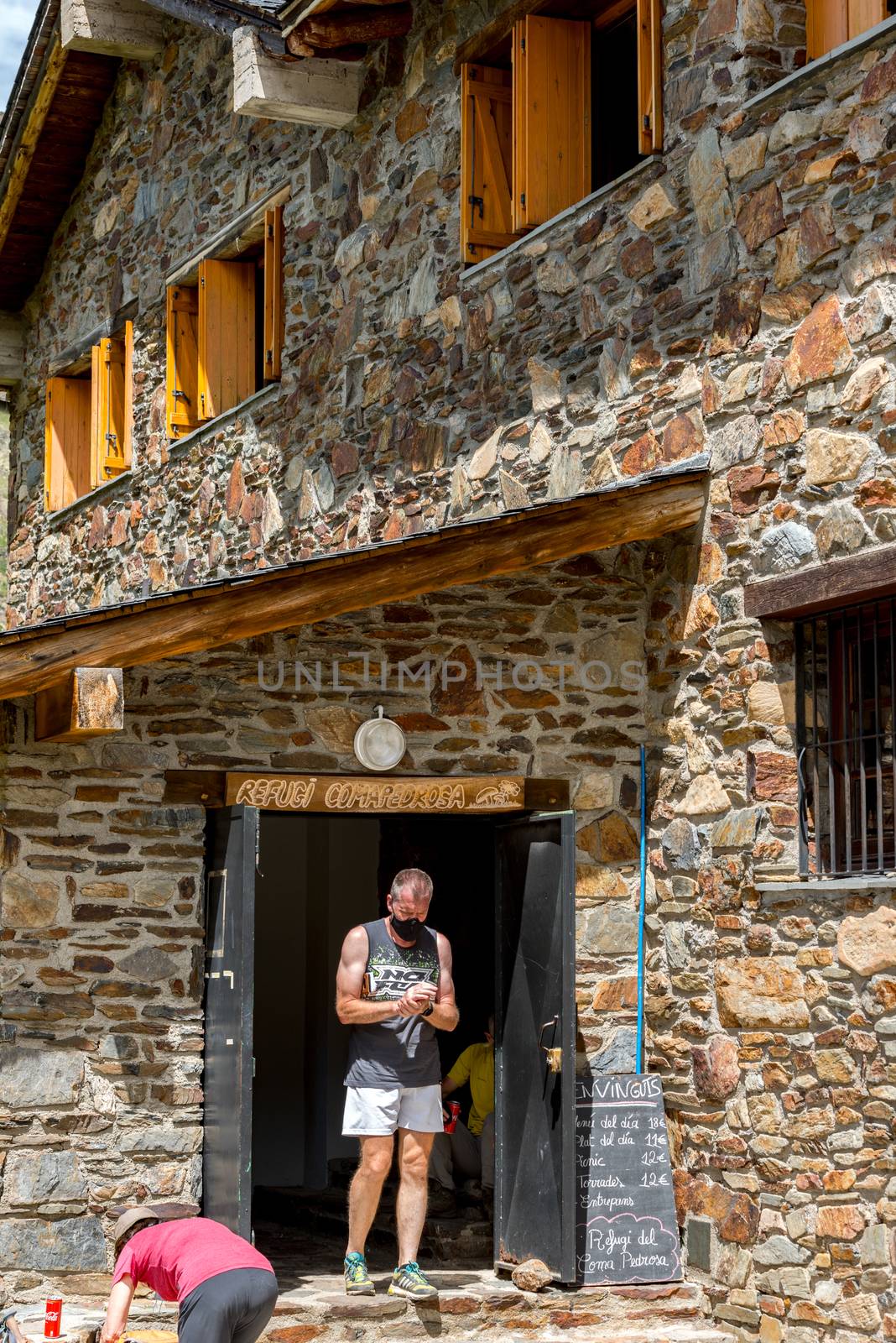 Group of Tourist in Coma Pedrosa refuge at 2266 meters of altitu by martinscphoto