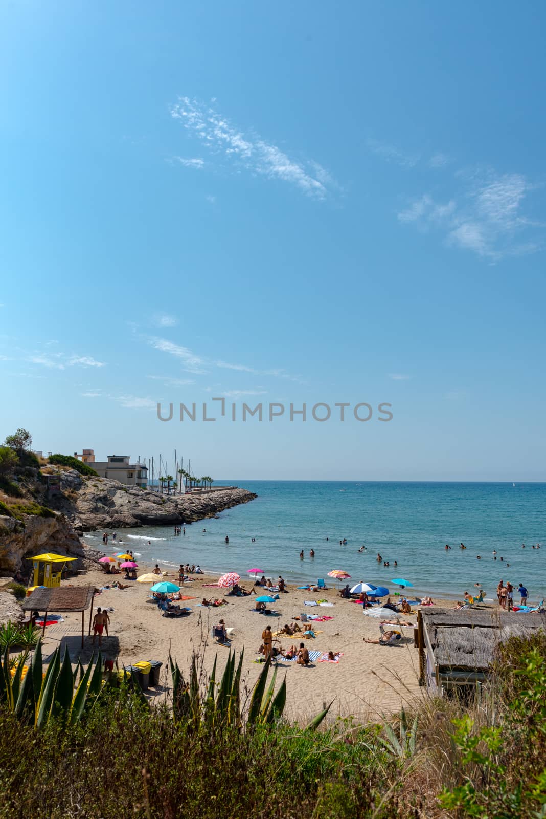 Sitges, Catalonia, Spain: July 28, 2020: People in the beach in Sitges in summer 2020.