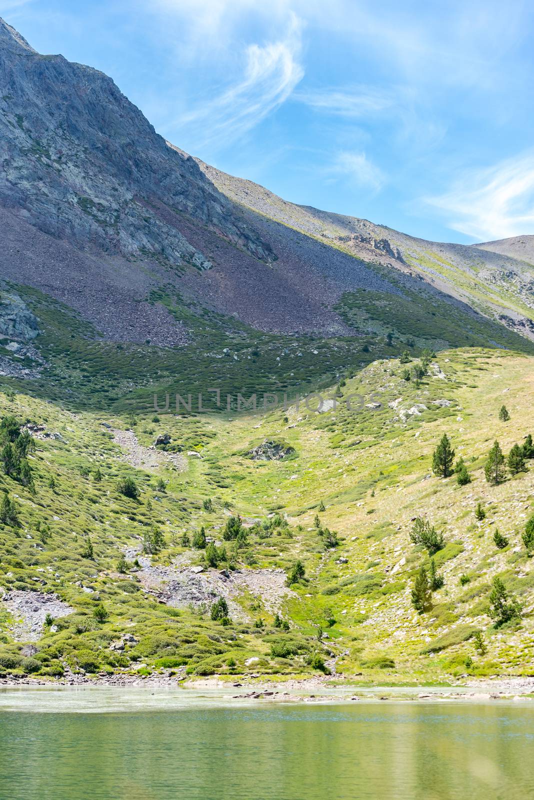 Mountain lake Estany de les Truites in Andorra Pyrenees, La Massana, Refugi de Coma Pedrosa