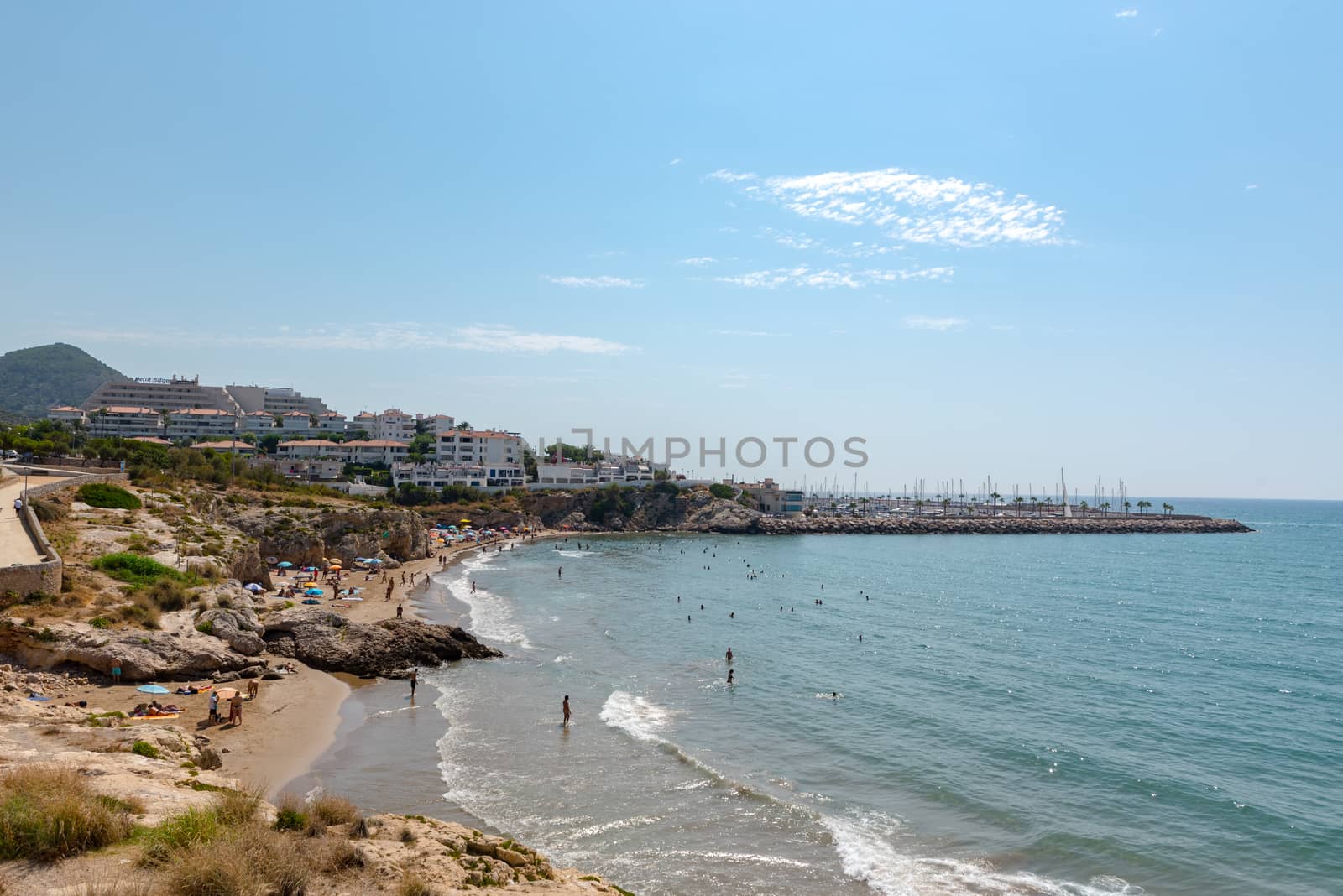 Sitges, Catalonia, Spain: July 28, 2020: People in the beach in Sitges in summer 2020.