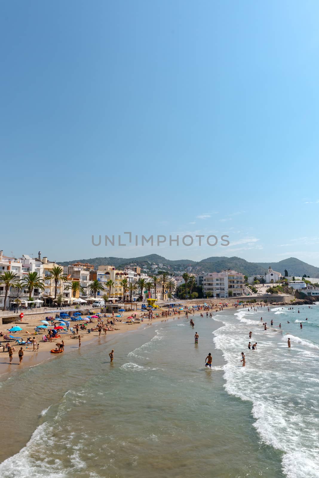 People in the beach in Sitges in summer 2020. by martinscphoto