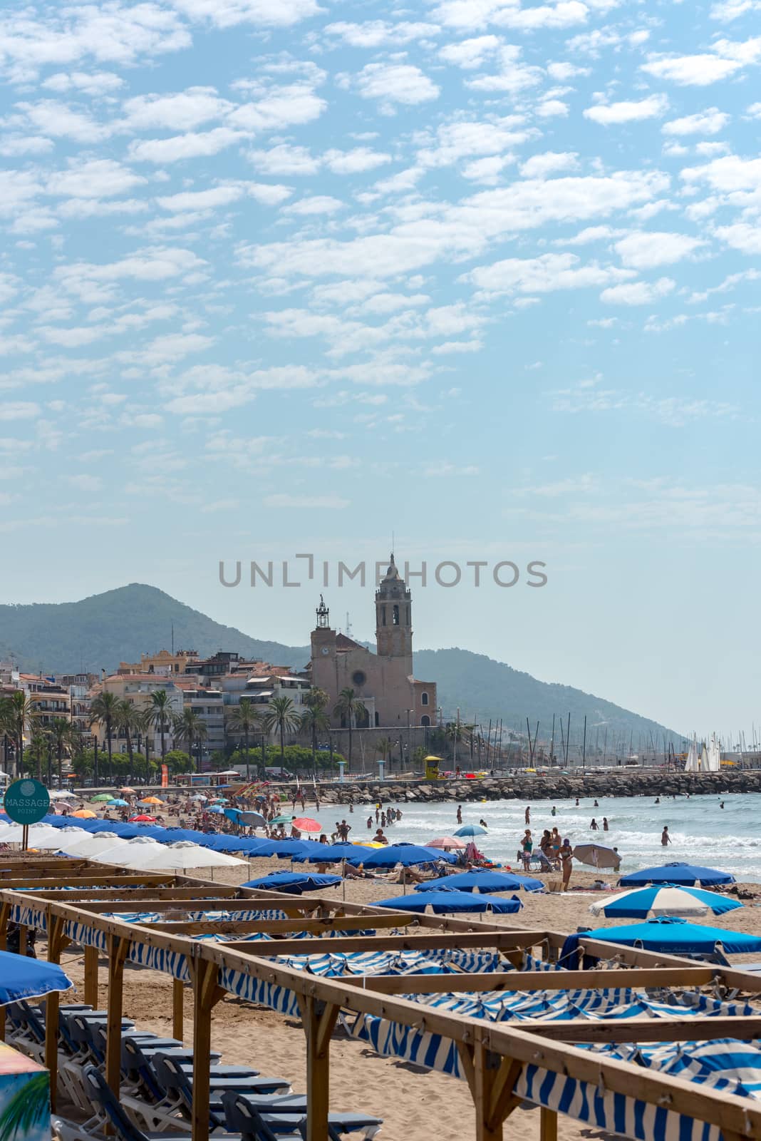 Sitges, Catalonia, Spain: July 28, 2020: People in the beach in Sitges in summer 2020.