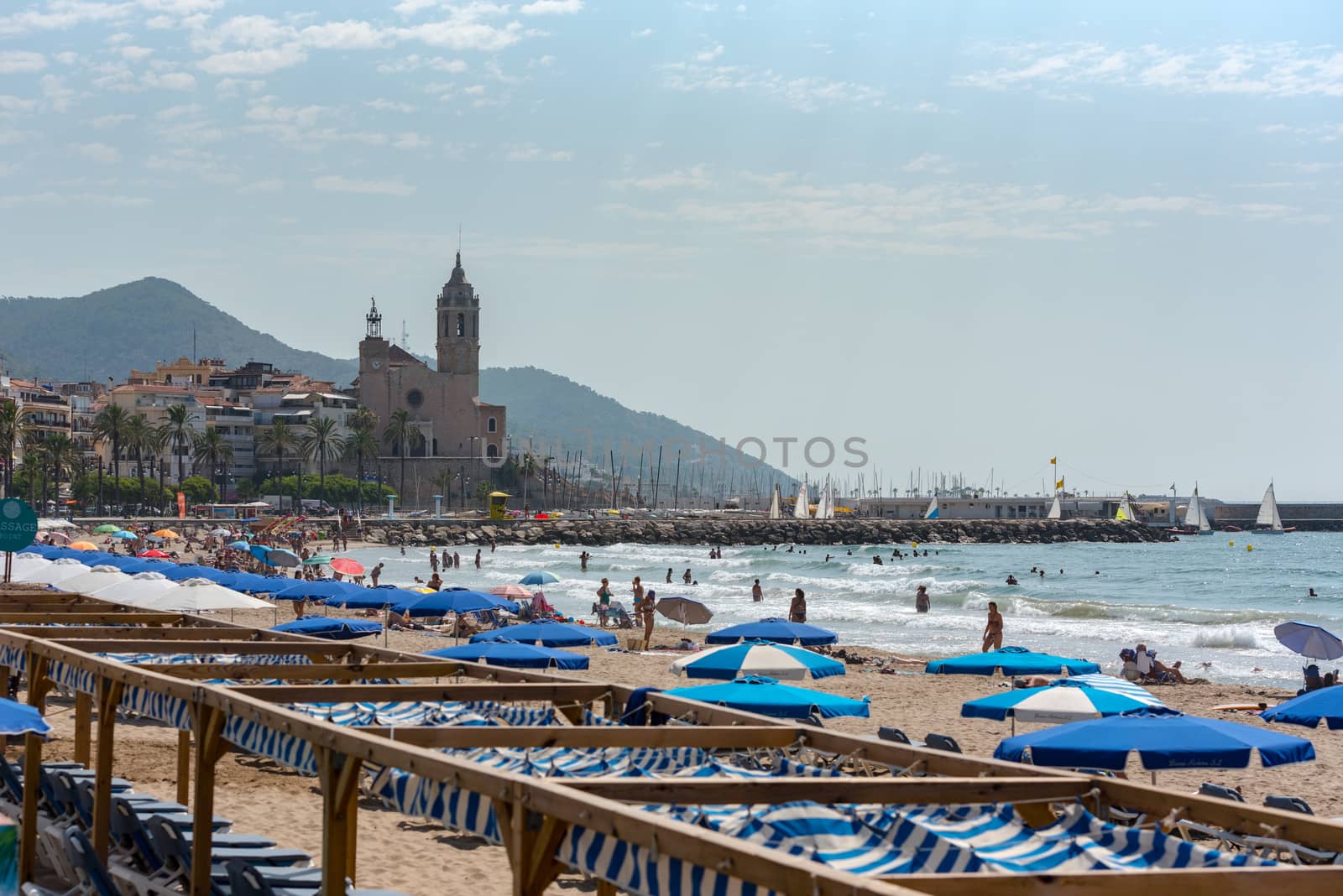 Sitges, Catalonia, Spain: July 28, 2020: People in the beach in Sitges in summer 2020.