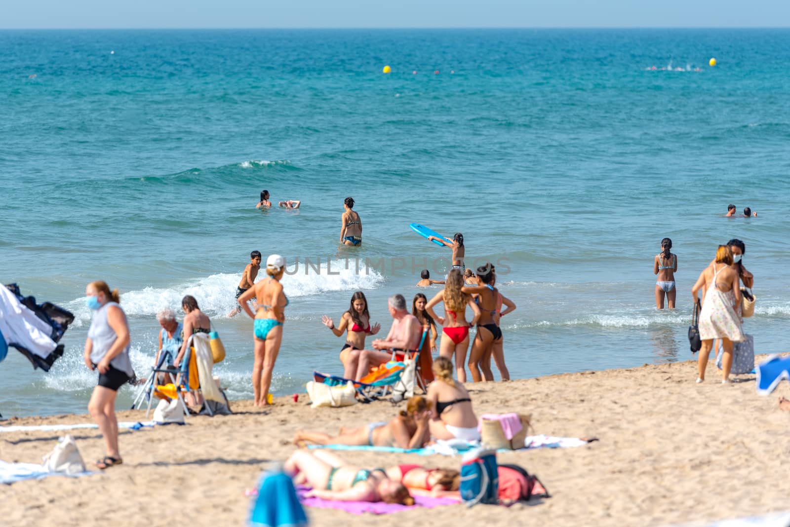 People in the beach in Sitges in summer 2020. by martinscphoto