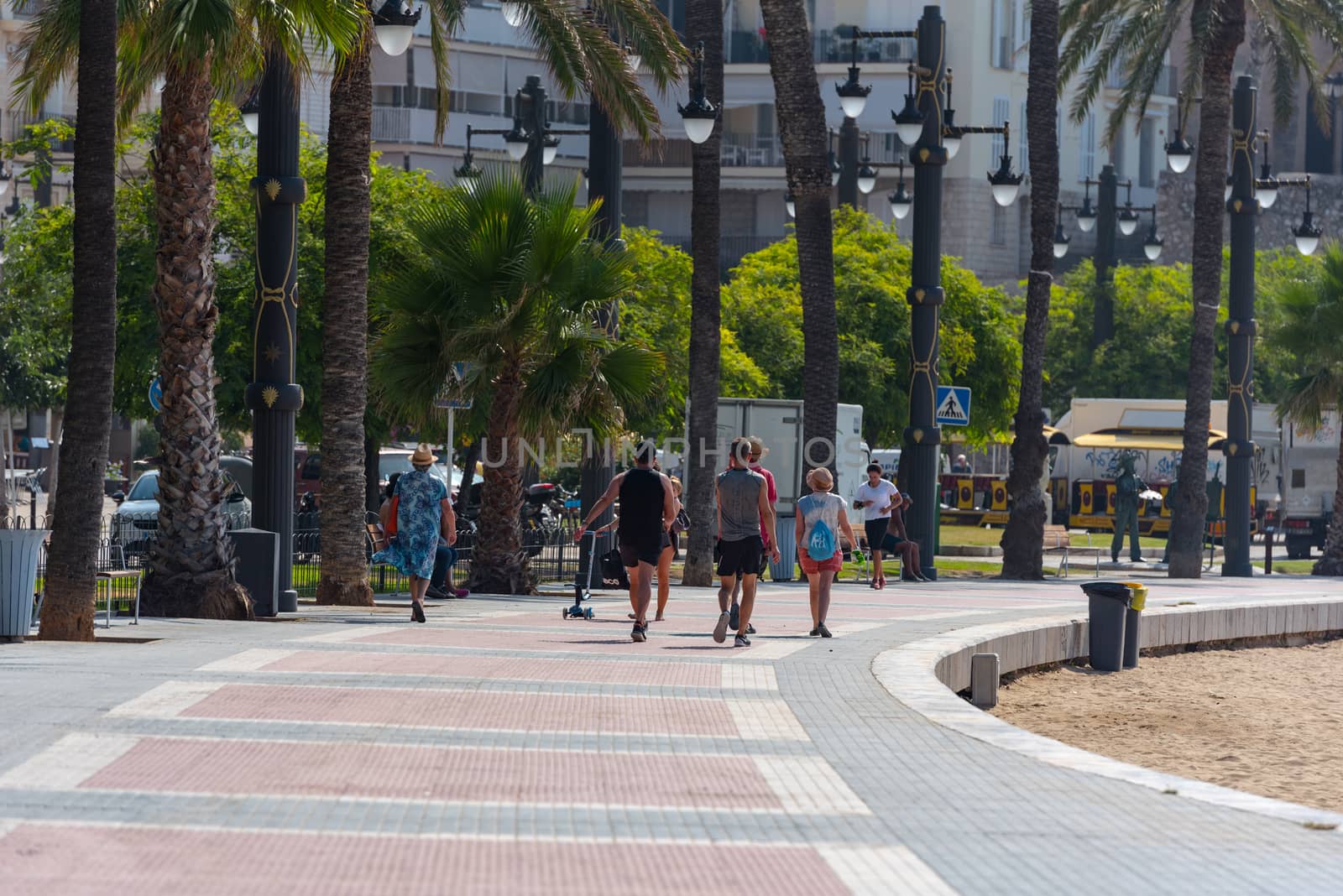 Sitges, Catalonia, Spain: July 28, 2020: People on the Paseo Maritimo in the city of Sitges in the summer of 2020.