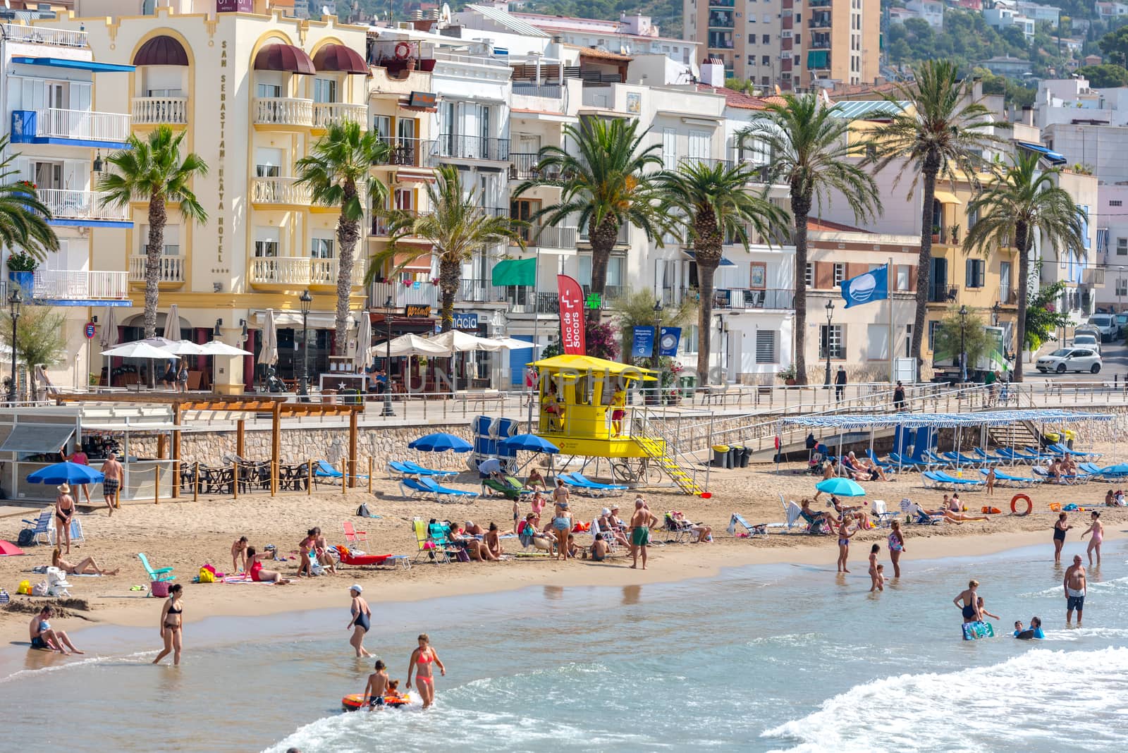 Sitges, Catalonia, Spain: July 28, 2020: People in the beach in Sitges in summer 2020.