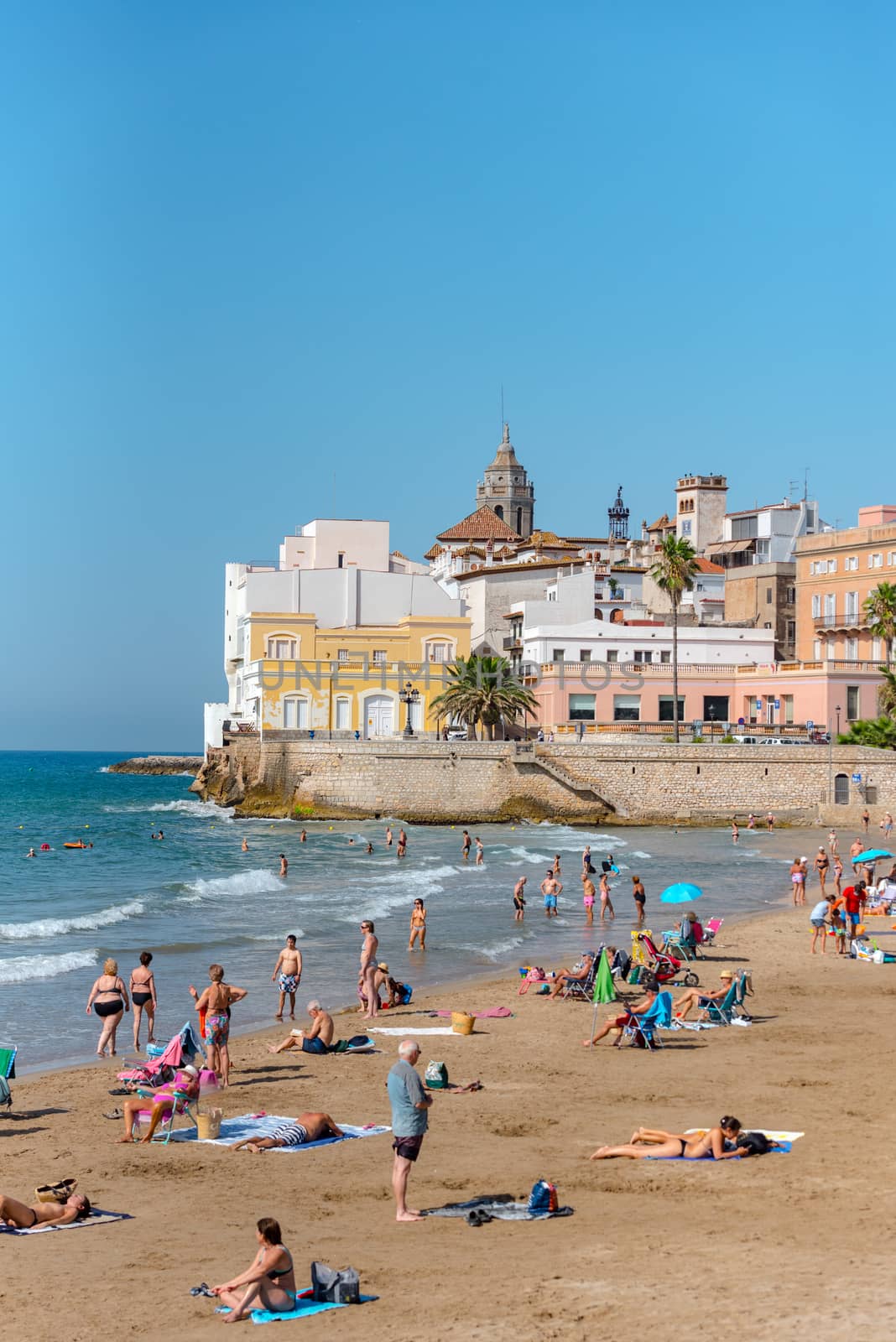 Sitges, Catalonia, Spain: July 28, 2020: People in the beach in Sitges in summer 2020.