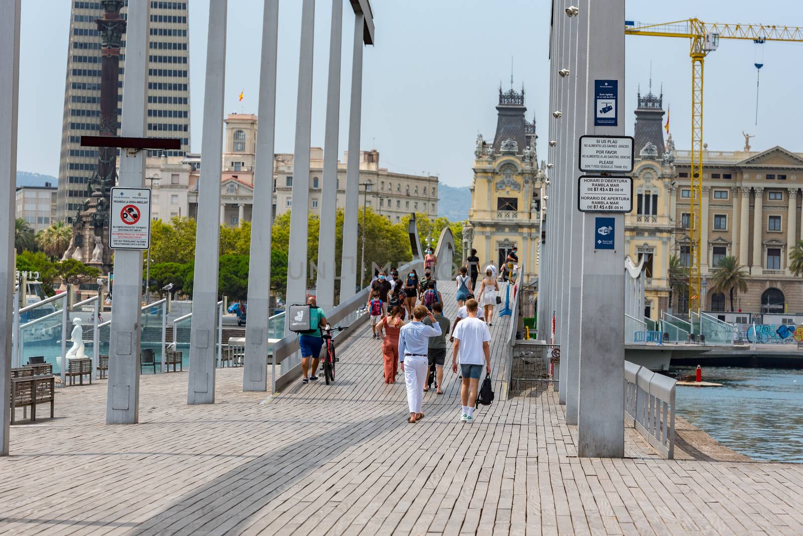 People walking through empty streets after COVID 19 in Barcelona by martinscphoto