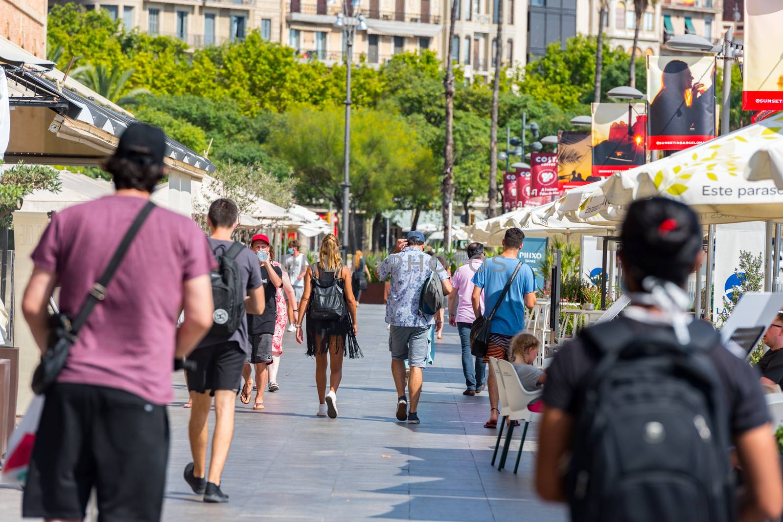 People walking through empty streets after COVID 19 in Barcelona by martinscphoto