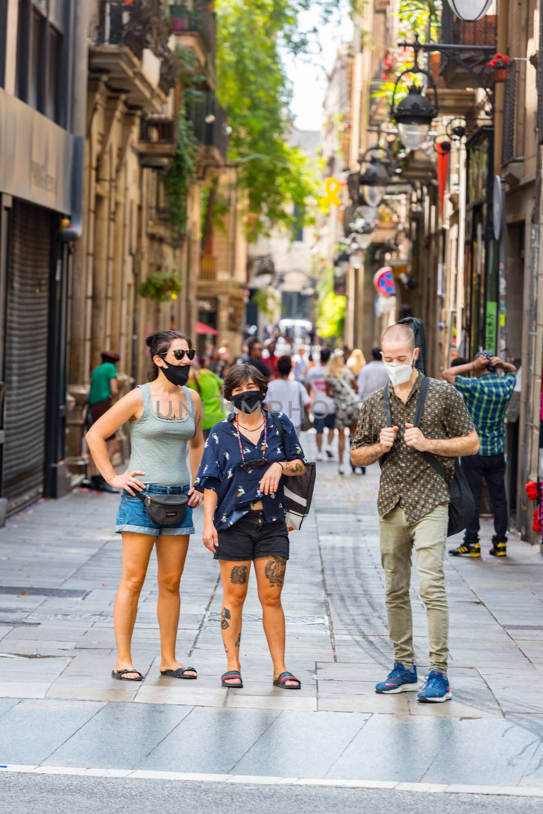 People walking through empty streets after COVID 19 in Barcelona by martinscphoto