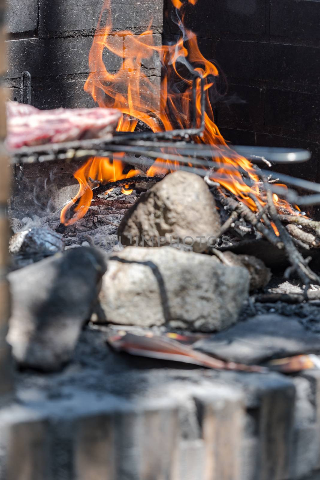 Closeup take of a traditional Argentinian and Uruguayan barbecue, Creole sausage, whit peppers and eggs.