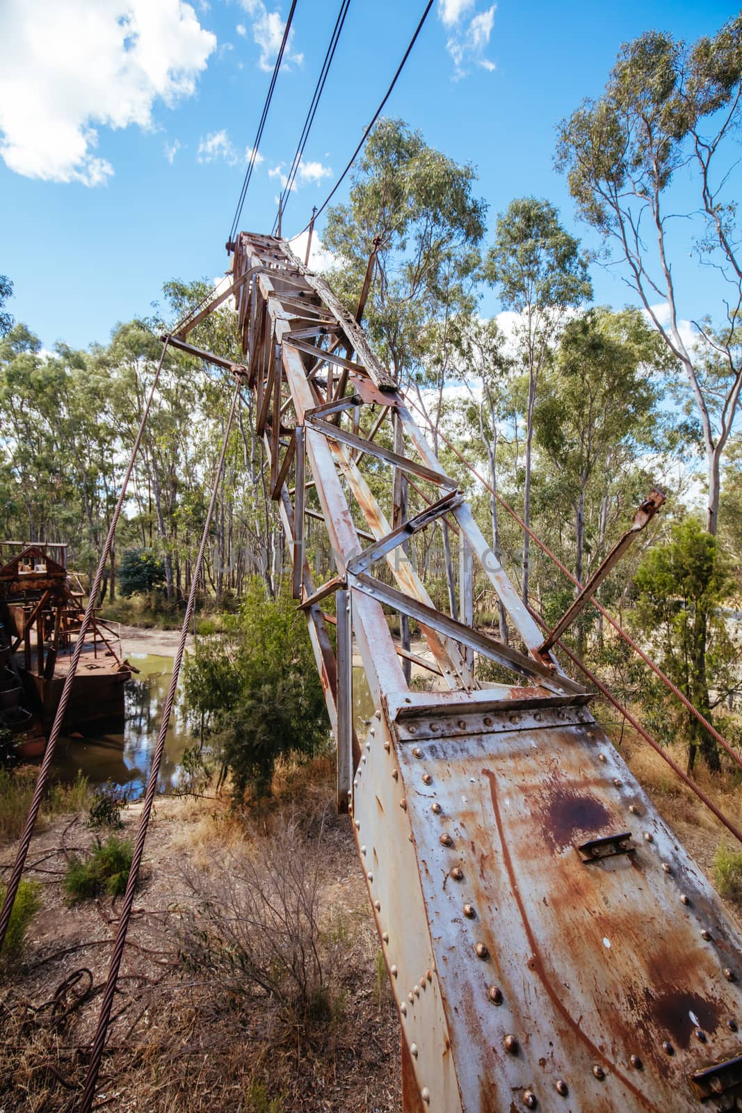 An old Dredge and Dragline which is an abandoned piece of gold mining equipment near Maldon in Victoria, Australia