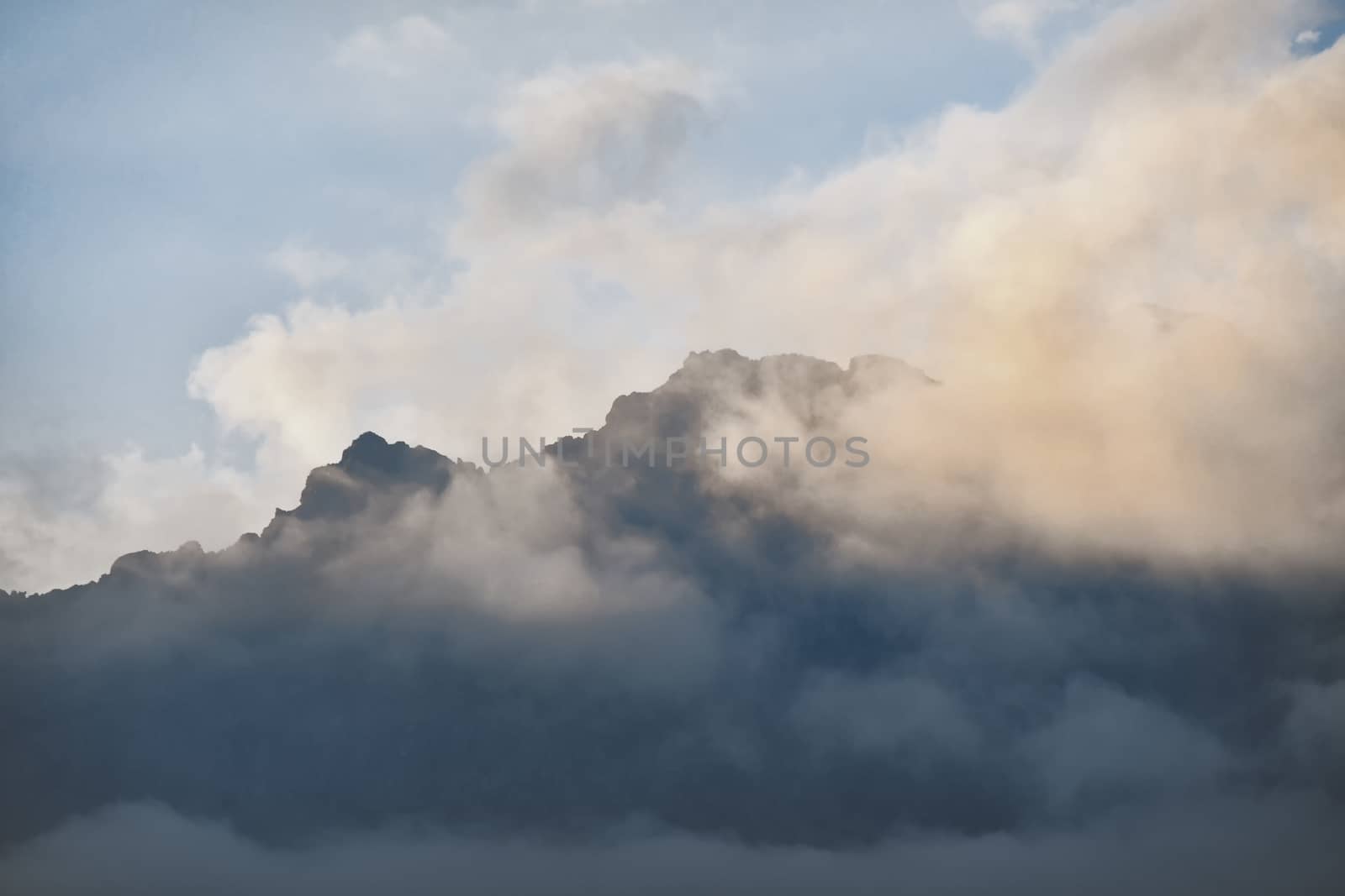 The colorful clouds above the summit of Mount Mars in the Biella pre-Alps
