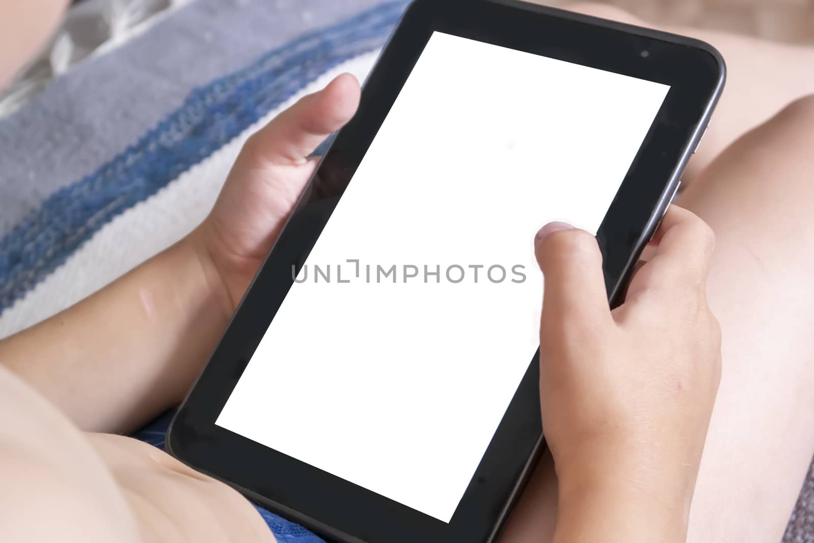 Little boy holding a tablet, a mock-up