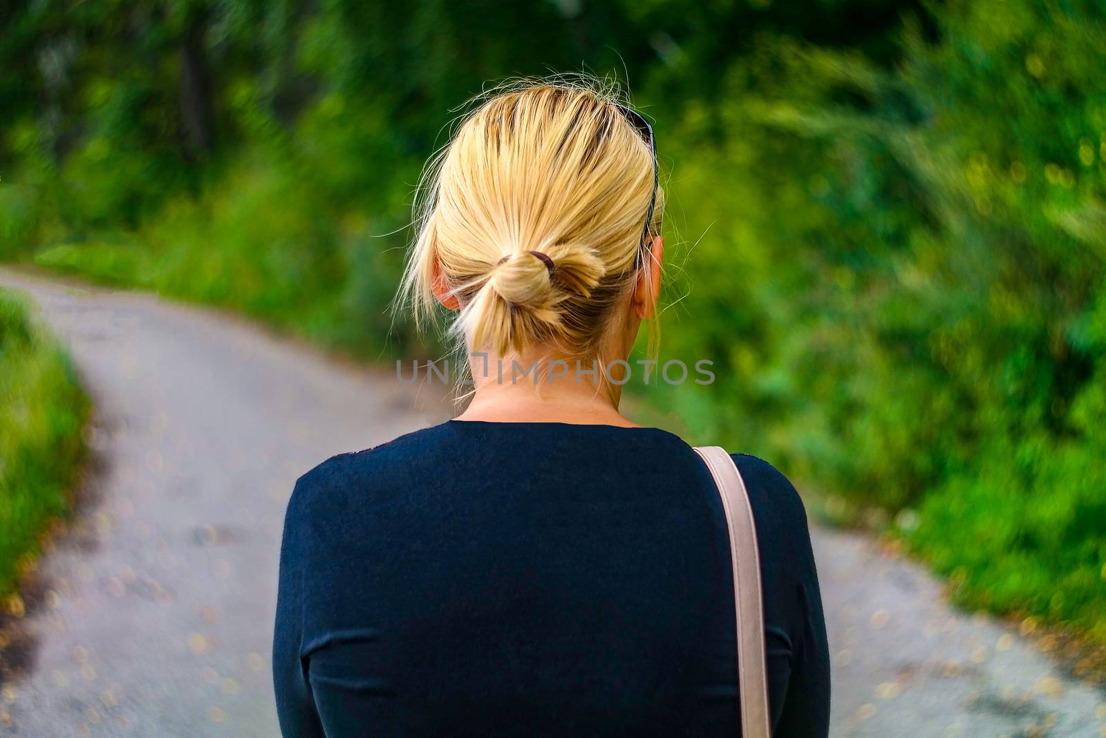 woman alone walks in the park