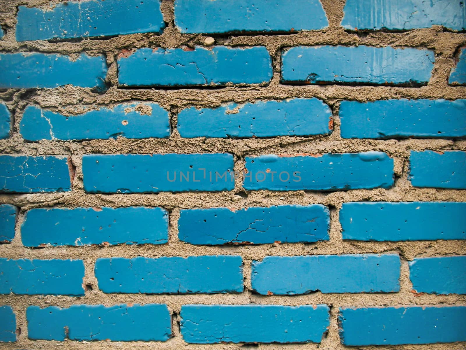 The brick wall painted in blue.A blue brick wall.