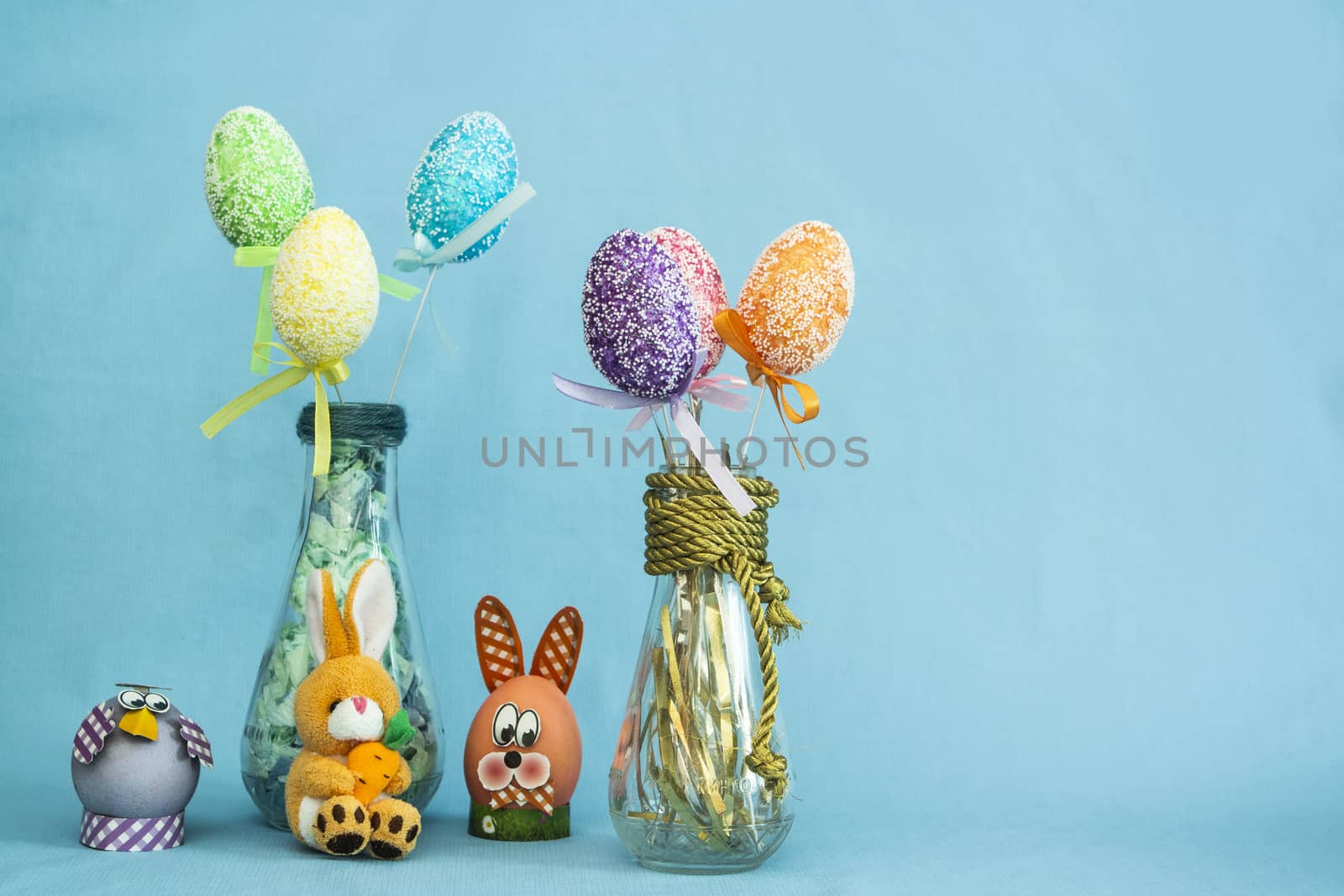 Easter composition with eggs on a blue background by Akmenra