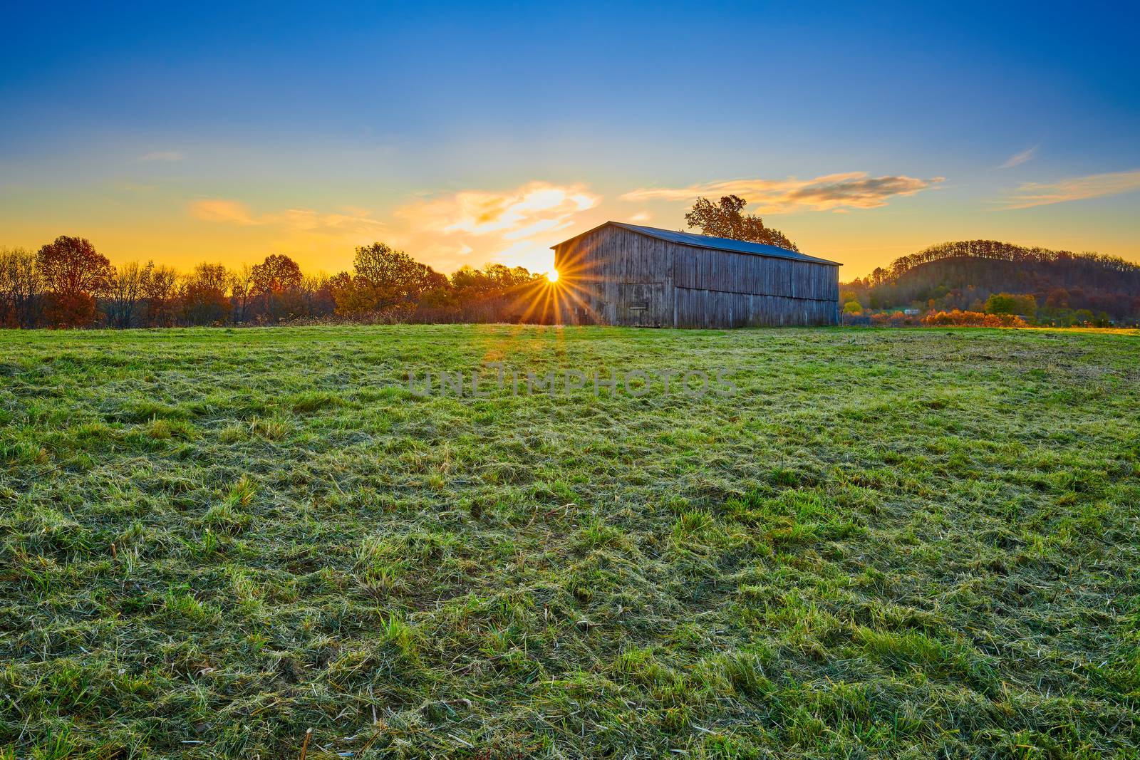 Tobacco barn at sunrise in Gravel Switch, Kentucky. by patrickstock