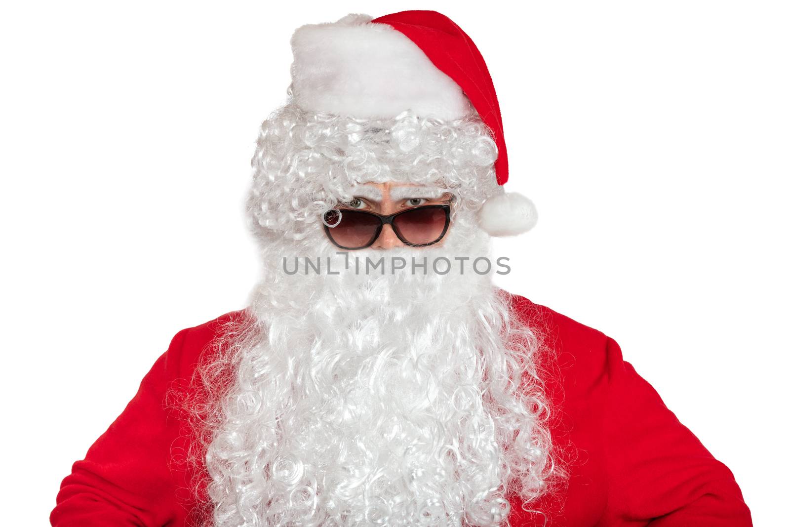 Santa Claus looking straight at the camera He looks angry and serious. He is wearing sunglasses, long white beard. Isolated on white background by DamantisZ