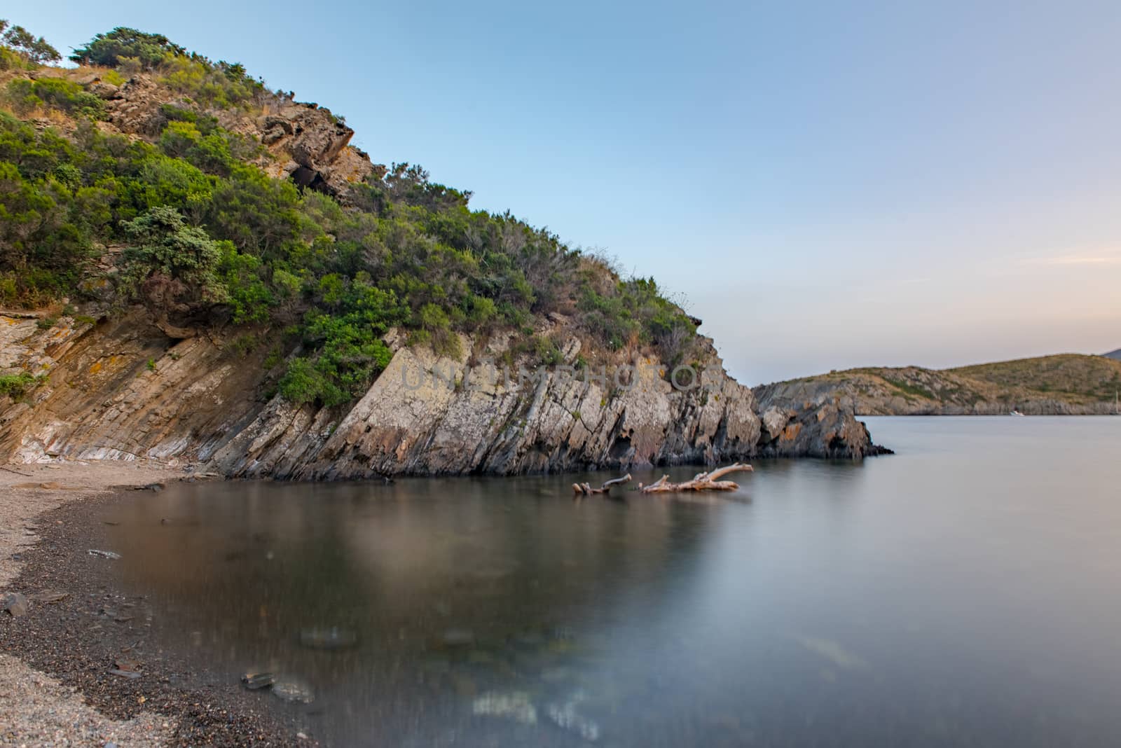 Spain Costa Brava peaceful pebble beach of the Mediterranean sea by martinscphoto