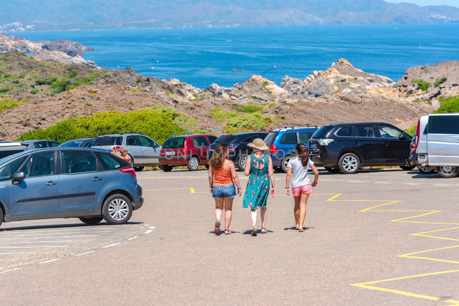 Parc Natural Cap de Creus, Spain :  8 july 2020 : People in Cap de Creus, natural park. Eastern point of Spain, Girona province, Catalonia. Famous tourist destination in Costa Brava. Sunny summer day with blue sky and clouds