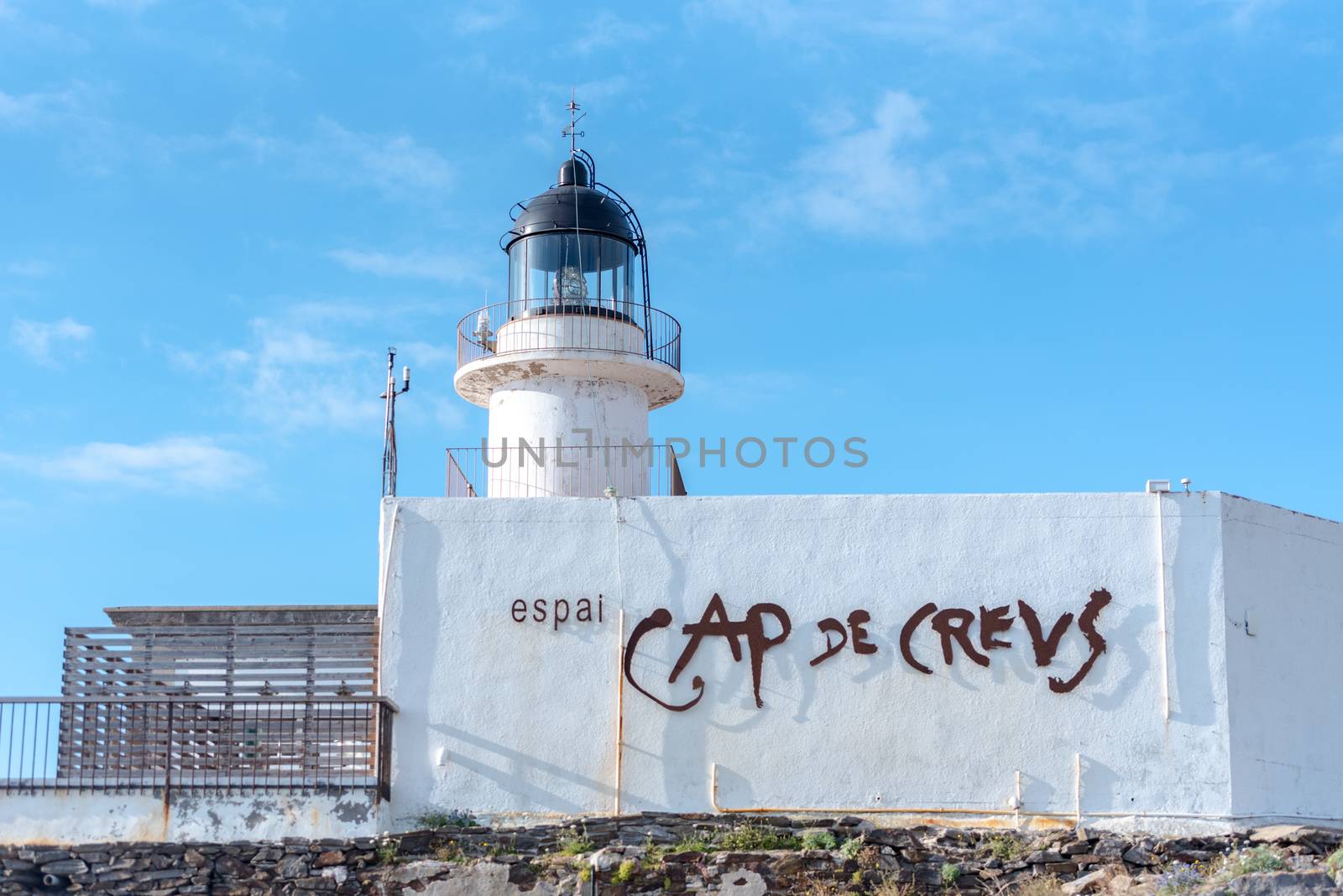 Parc Natural Cap de Creus, Spain :  8 july 2020 : Cap de Creus, natural park. Eastern point of Spain, Girona province, Catalonia. Lighthouse in  tourist destination in Costa Brava. Sunny summer day with blue sky and clouds