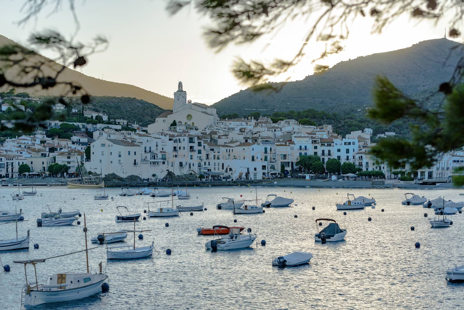 Cadaques, Spain : 07 JULY 2020 : Boats in the beach and houses of the village of Cadaques, Spain in summer on 07 july 2020.