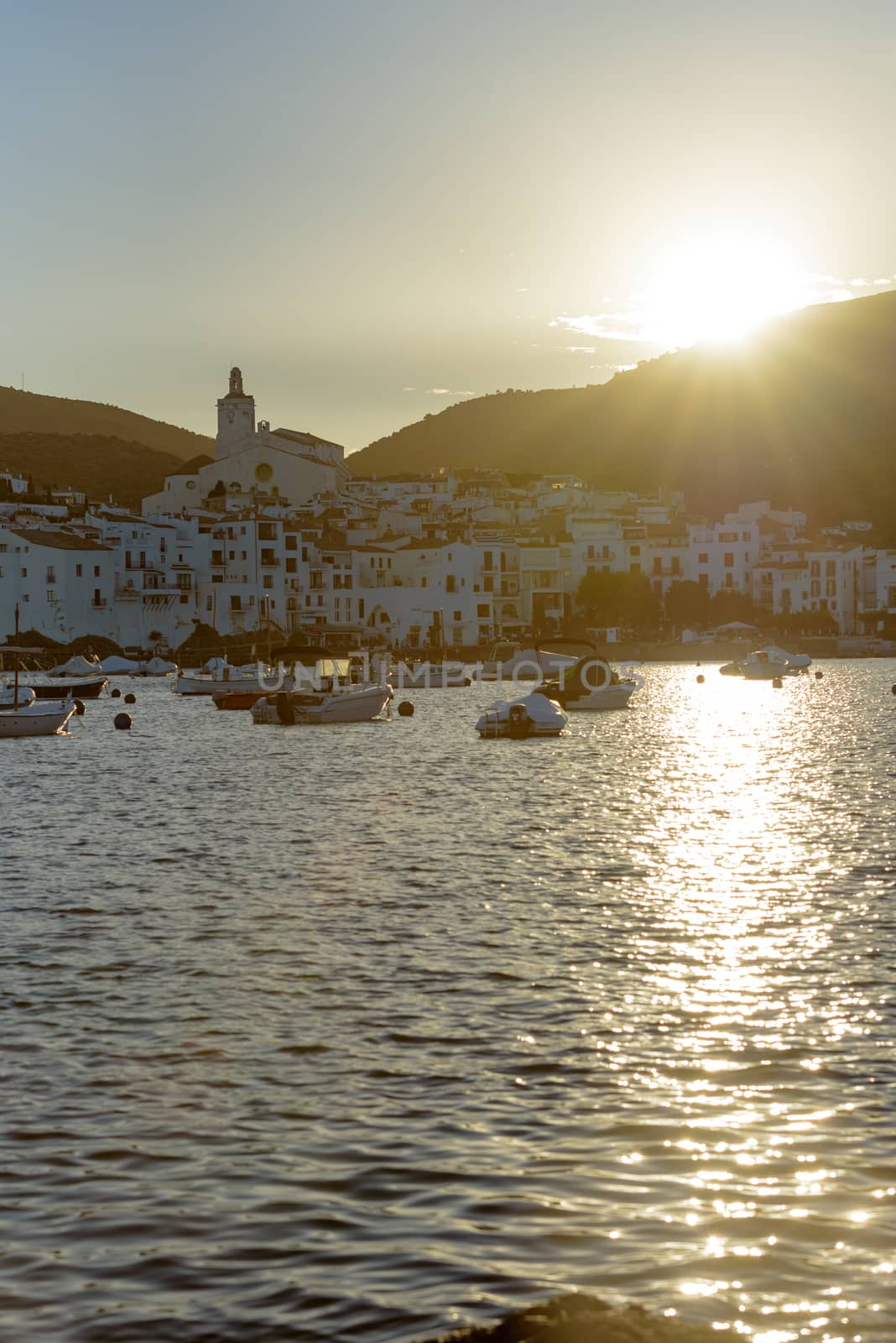 Cadaques, Spain : 07 JULY 2020 : Boats in the beach and houses of the village of Cadaques, Spain in summer on 07 july 2020.