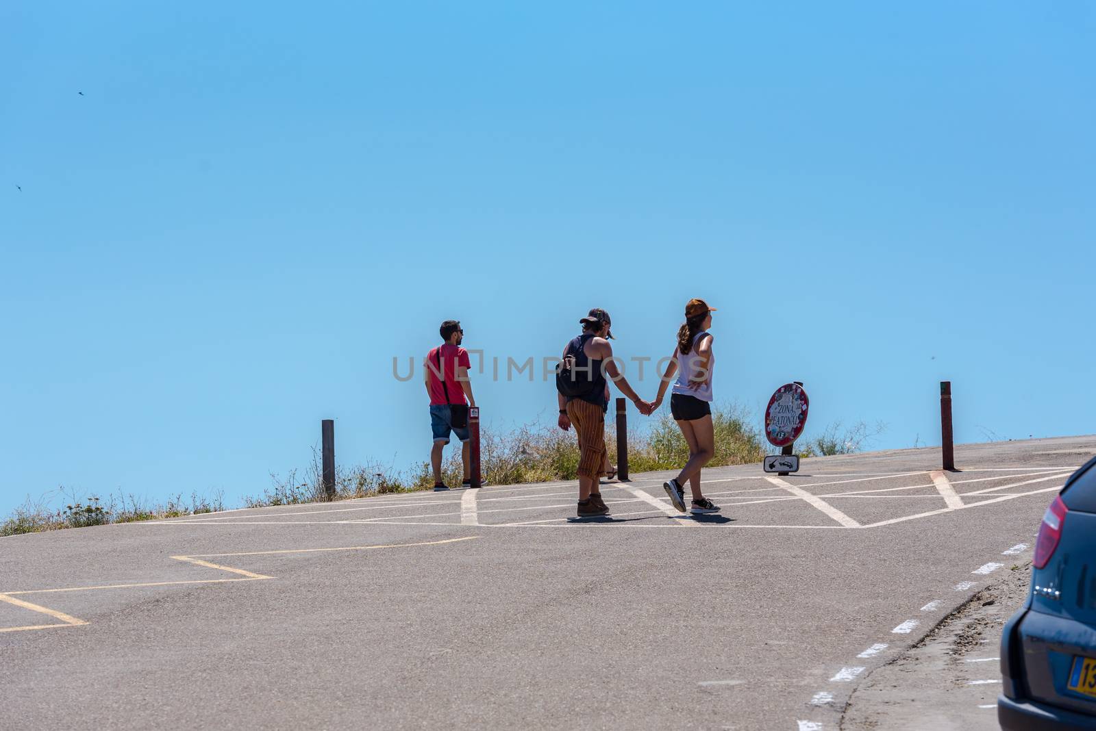 Parc Natural Cap de Creus, Spain :  8 july 2020 : People in Cap de Creus, natural park. Eastern point of Spain, Girona province, Catalonia. Famous tourist destination in Costa Brava. Sunny summer day with blue sky and clouds