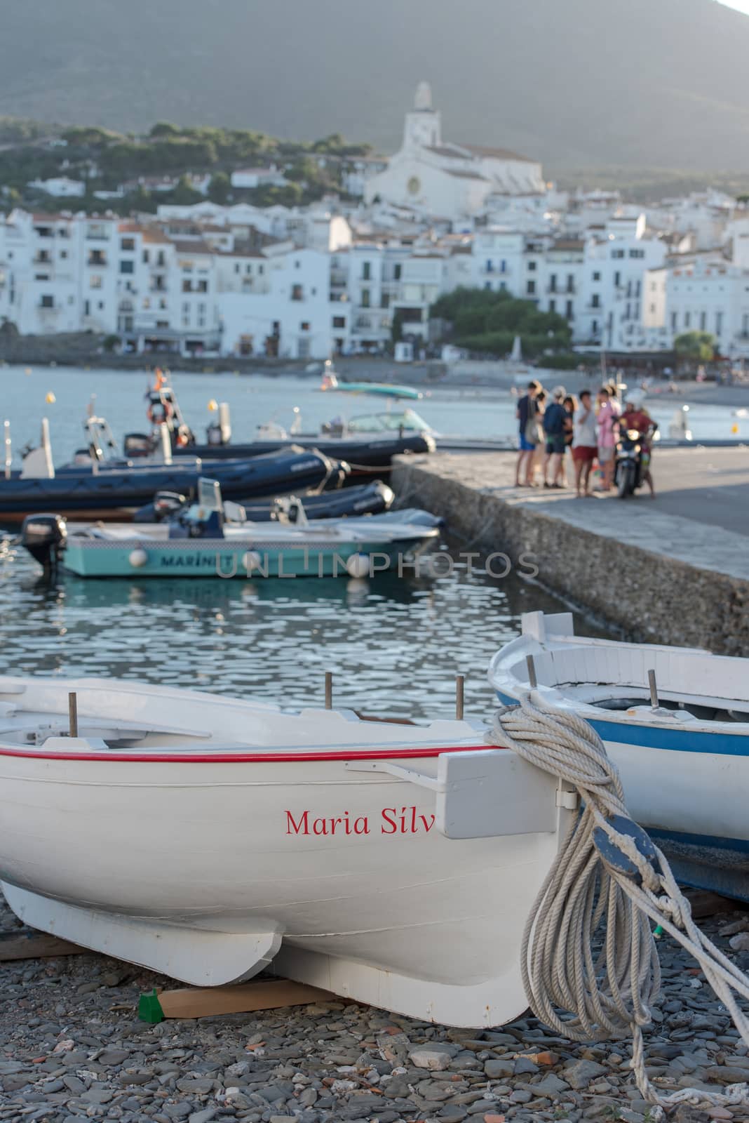 Cadaques, Spain : 07 JULY 2020 : Boats in the beach and houses of the village of Cadaques, Spain in summer on 07 july 2020.