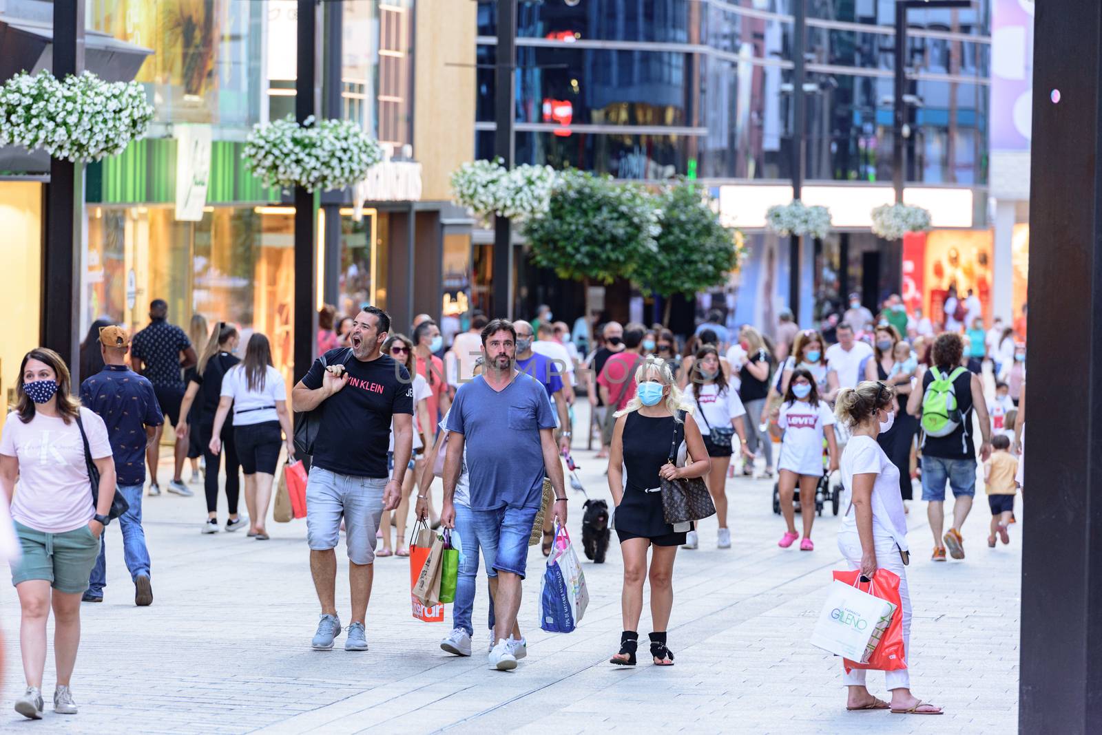 People Walk in the Comercial Street named Meritxell after COVID1 by martinscphoto