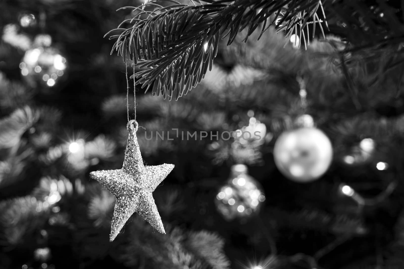 A star-shaped spruce tree decoration during Christmas in Poland, monochrome