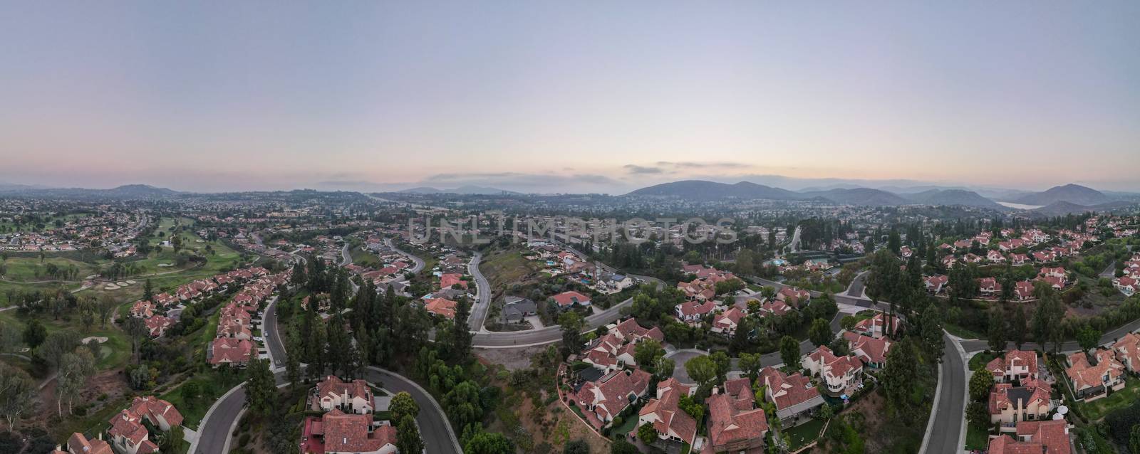 Aerial panoramic view of middle class neighborhood with residential house community in Rancho Bernardo during sunset, South California, USA.