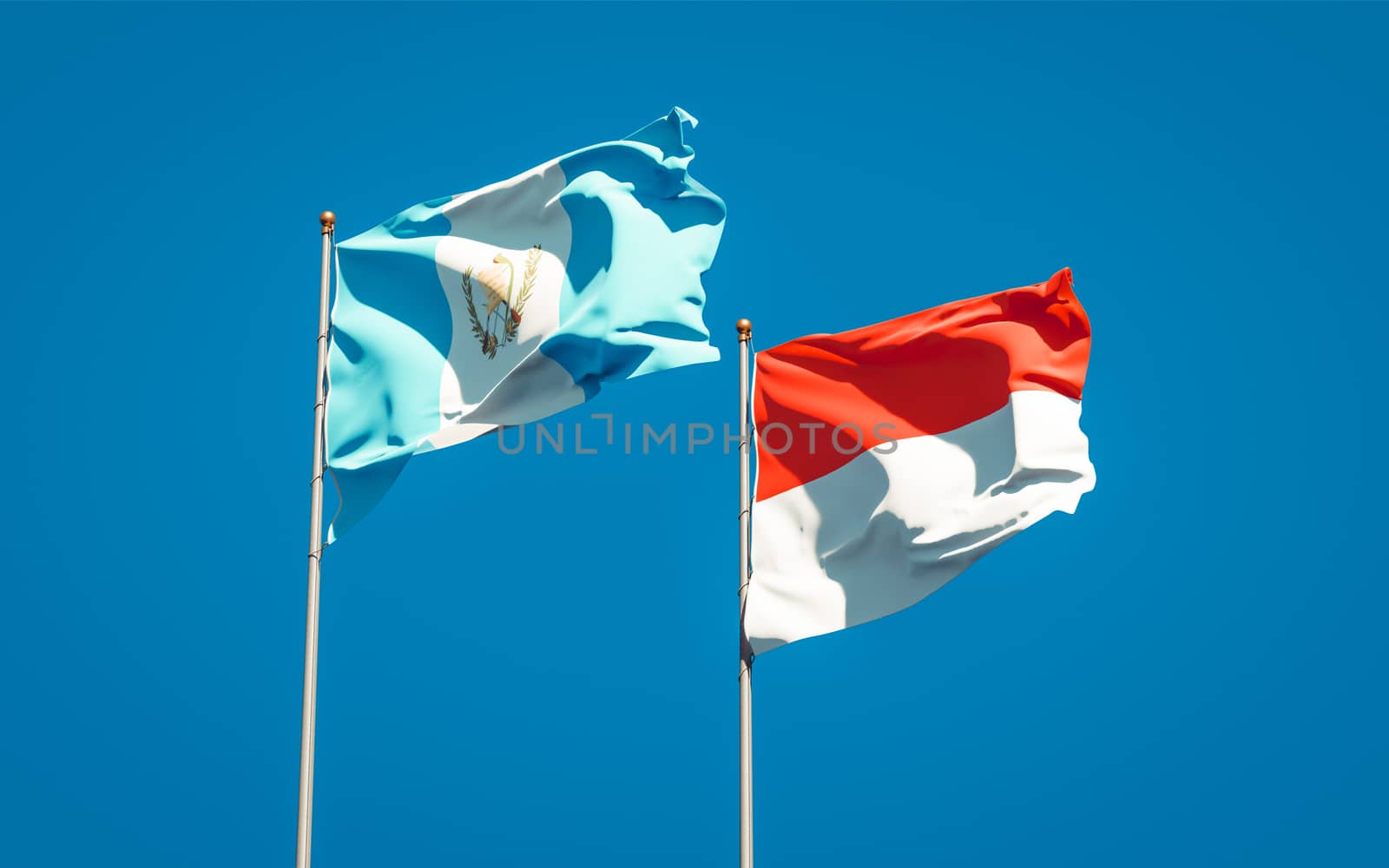 Beautiful national state flags of Guatemala and Indonesia together at the sky background. 3D artwork concept. 