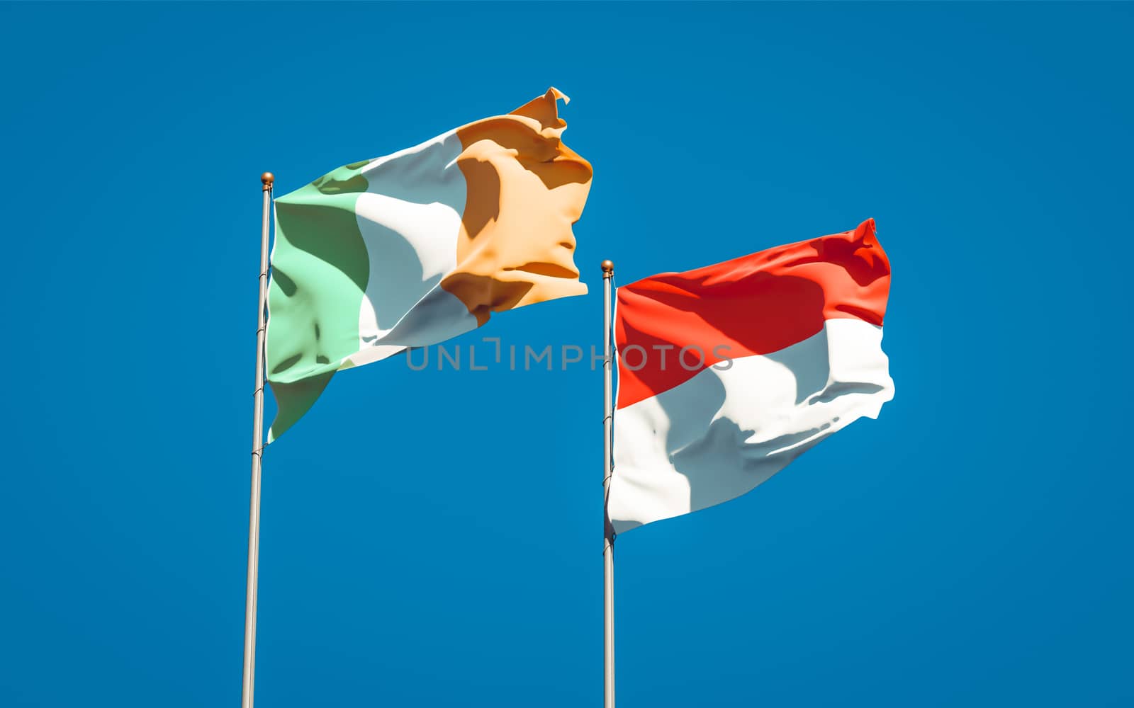 Beautiful national state flags of Ireland and Indonesia together at the sky background. 3D artwork concept. 