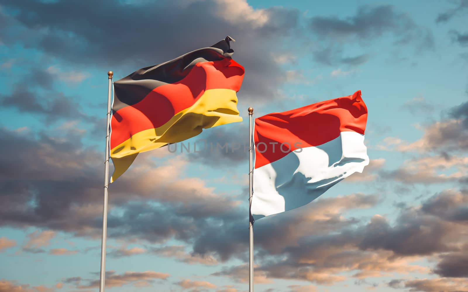 Beautiful national state flags of Germany and Indonesia together at the sky background. 3D artwork concept. 