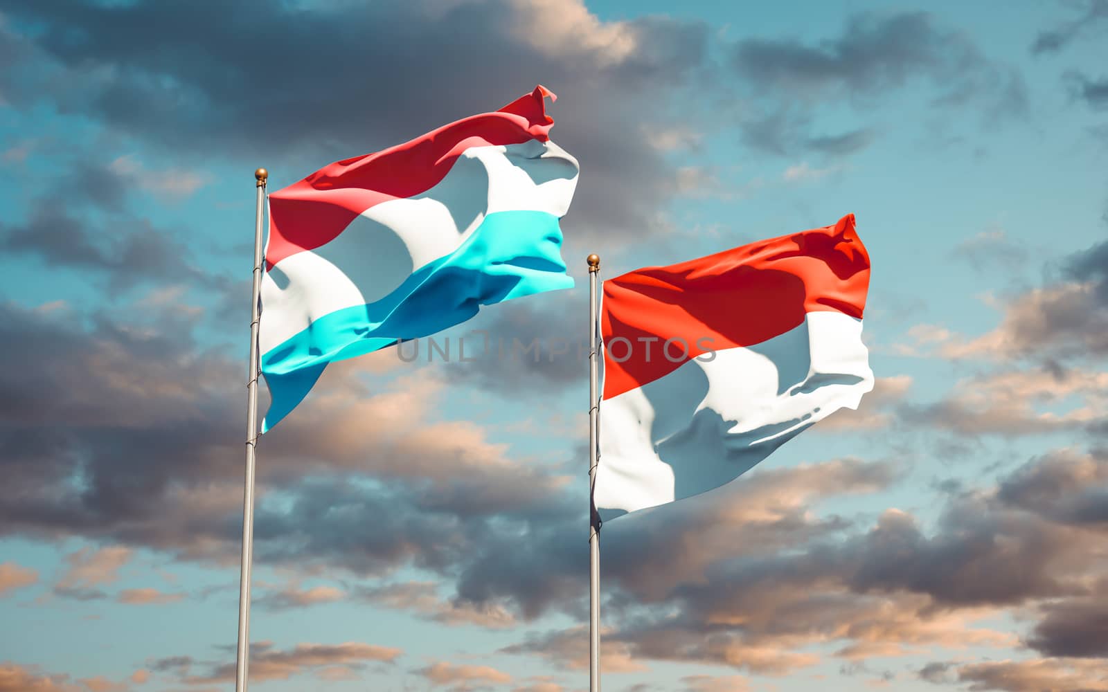 Beautiful national state flags of Luxembourg and Indonesia together at the sky background. 3D artwork concept. 