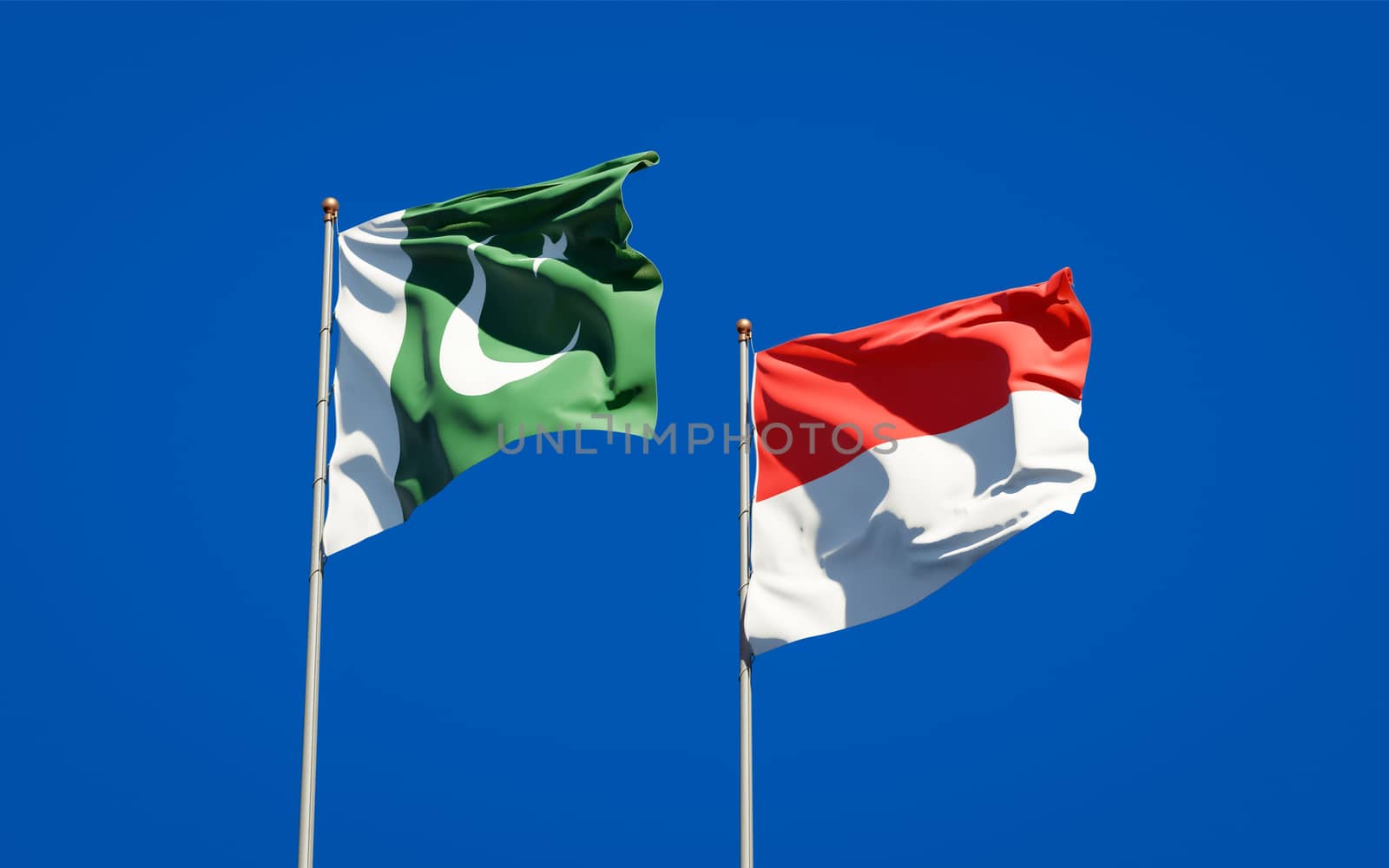 Beautiful national state flags of Pakistan and Indonesia together at the sky background. 3D artwork concept. 